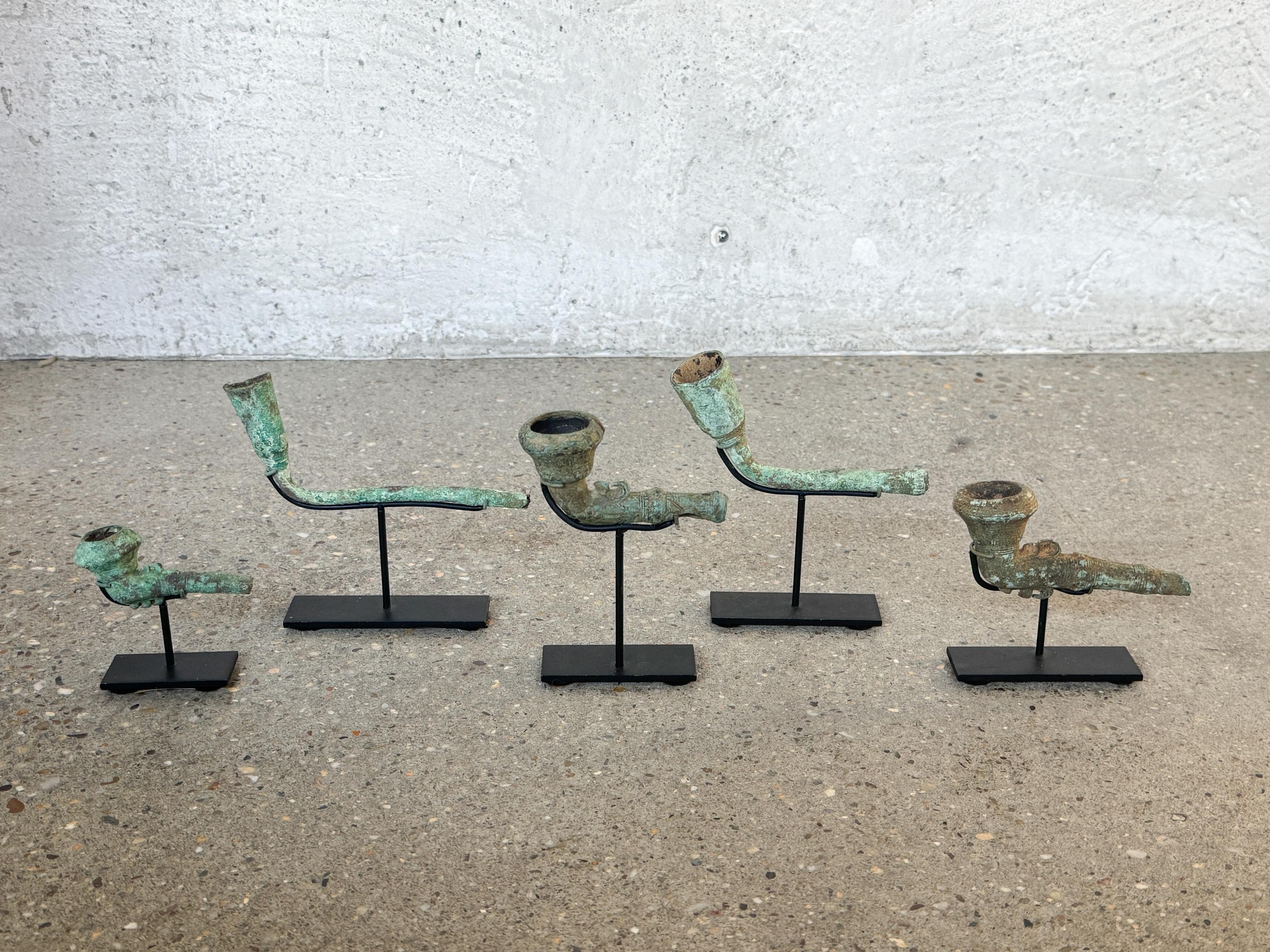 16th-17th Century Bronze Pipe Heads from Central Highlands, Vietnam.  The set of five bronze pipe heads, recovered during controlled excavation in Central Highlands, Vietnam.  Technical style, alloy composition and corrosion morphology support a