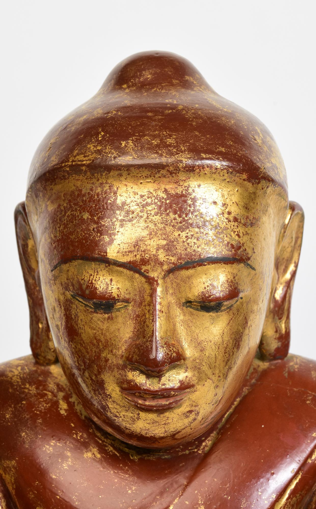 Rare antique Burmese wooden Buddha sitting in Mara Vijaya (calling the earth to witness) posture on double lotus base.

Age: Burma, Ava Period, 16th Century
Size: Height 49.5 C.M. / Width 28 C.M. / Depth 18.5 C.M.
Condition: Nice condition overall