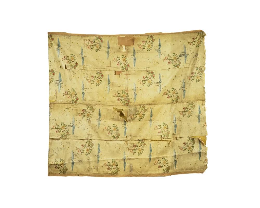 An antique Italian hand embroidered silk textile wall hanging. Circa the late 16th century. The ware is adorned with embroidered floral, foliate scroll, and foliage patterns. A yellow linen on the backside. Antique European Italian Textiles, and