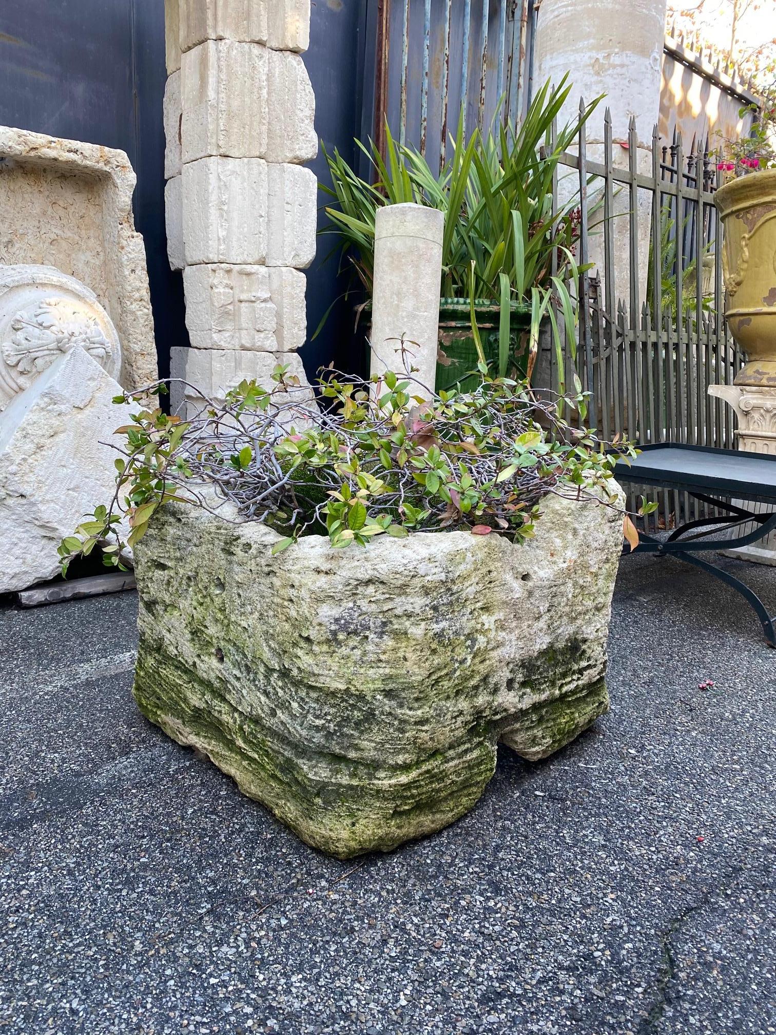 A rare hand carved 16th century hand well head square shape with carved out corners. Simple lines on this vessel rustic in feel. To be used in a modern traditional Spanish French design, very versatile as an interior planter stone container