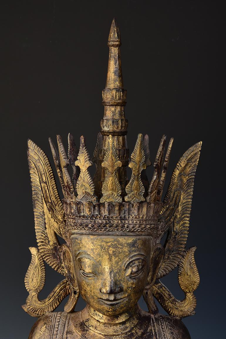 Rare Tai Yai Burmese wooden seated crowned Buddha, or sometimes known as 'King Buddha', wearing a diadem-crown and ornaments of a king instead of ordinary monk's robes.

Tai Yai is a group of tribal people living in Burma. It is difficult to find