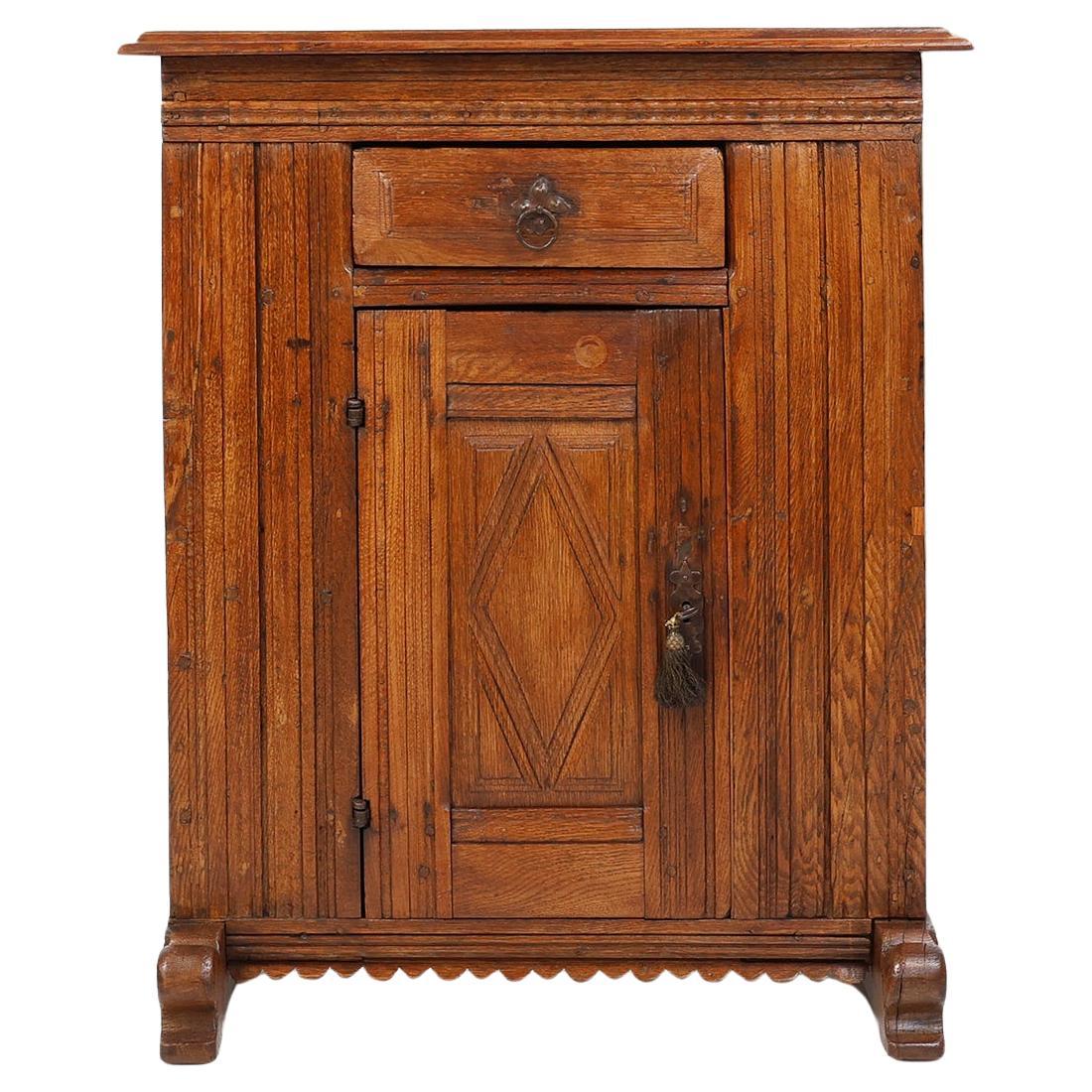 16th Century Belgian hand carved single door cabinet in full oak
