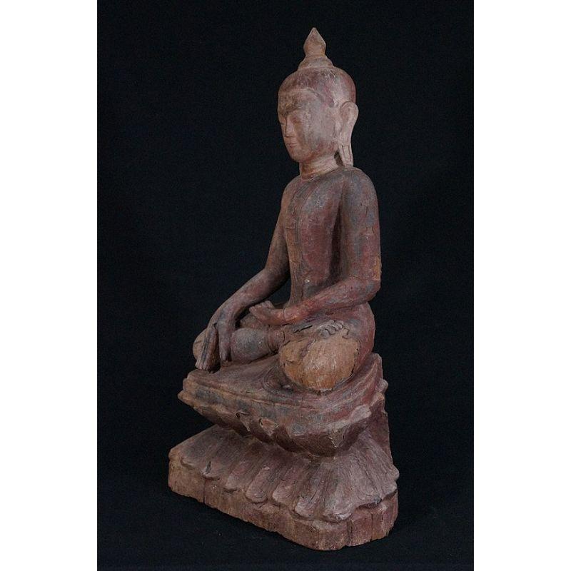 Material: wood,
Measures: 70 cm high 
40 cm wide.
Weight: 12.3 kgs.
Ava style.
Bhumisparsha mudra.
Originating from Burma.
16th Century - early Ava period.
A very good piece, high quality !

