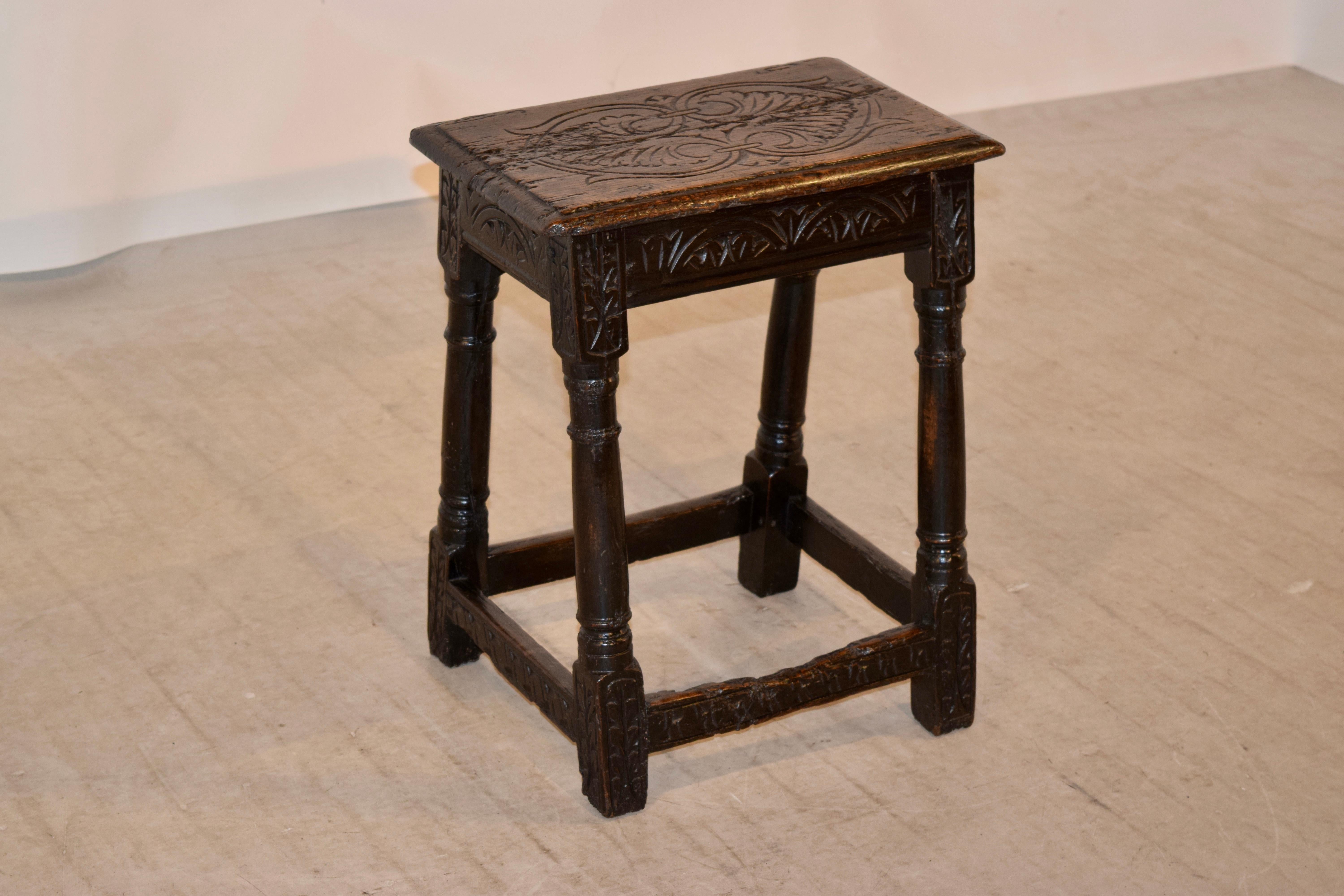 16th century English oak joint stool with plenty of wear and shrinkage throughout, which is just what you want to see in a stool of this age. The seat is decorated with hand carvings and has a bevelled edge following down to a simple apron, which is