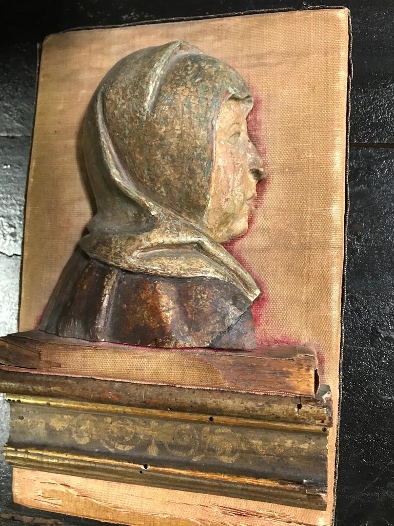 A carved and polychromed wood relief of the Girolamo Savonarola (1452-1498), de facto ruler of Florence. His face shown in profile with stern expression, wearing the hood of the Dominican Order.  This rare carving retains much of its original paint.