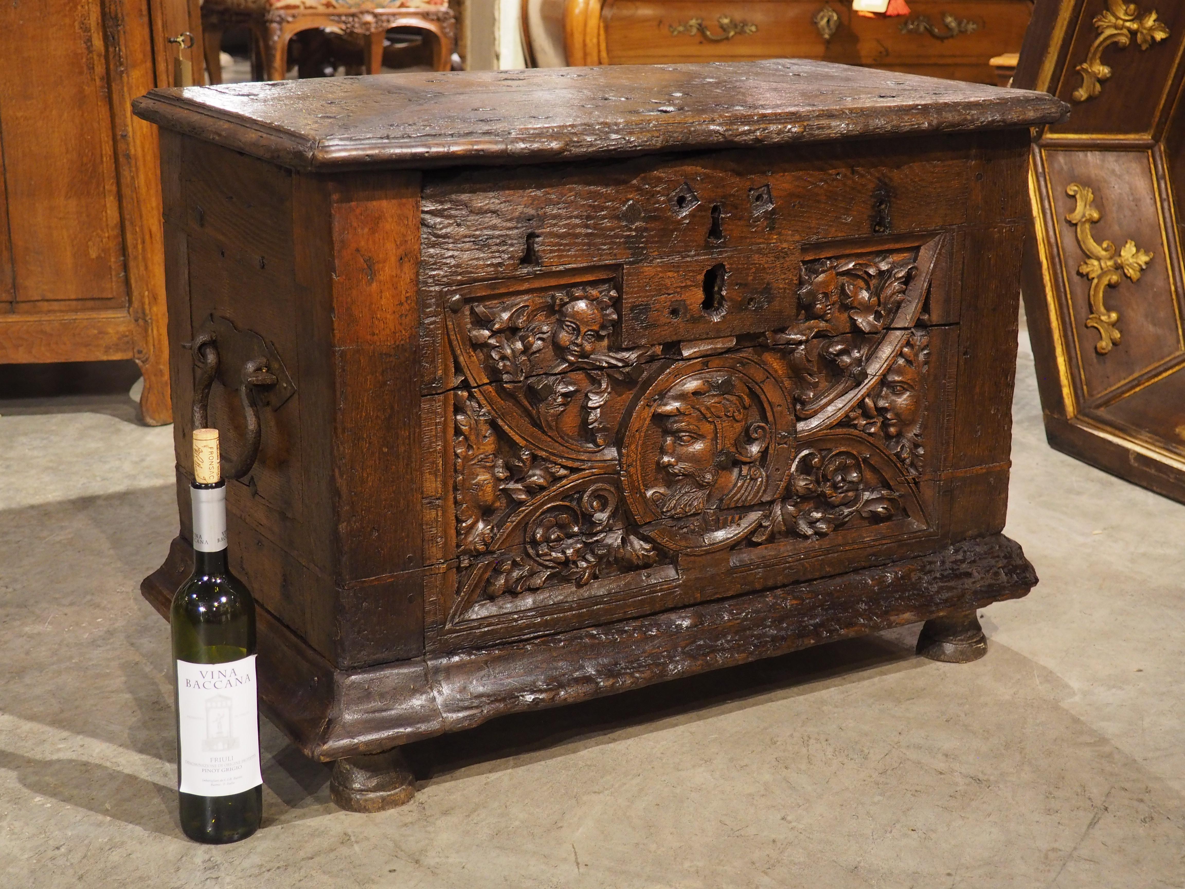 The beautifully carved front façade is not the only impressive element of this oak strongbox trunk; the interior is reinforced with an iron strapwork “cage”, strengthening the already robust trunk. Hand-carved during the Renaissance period (the