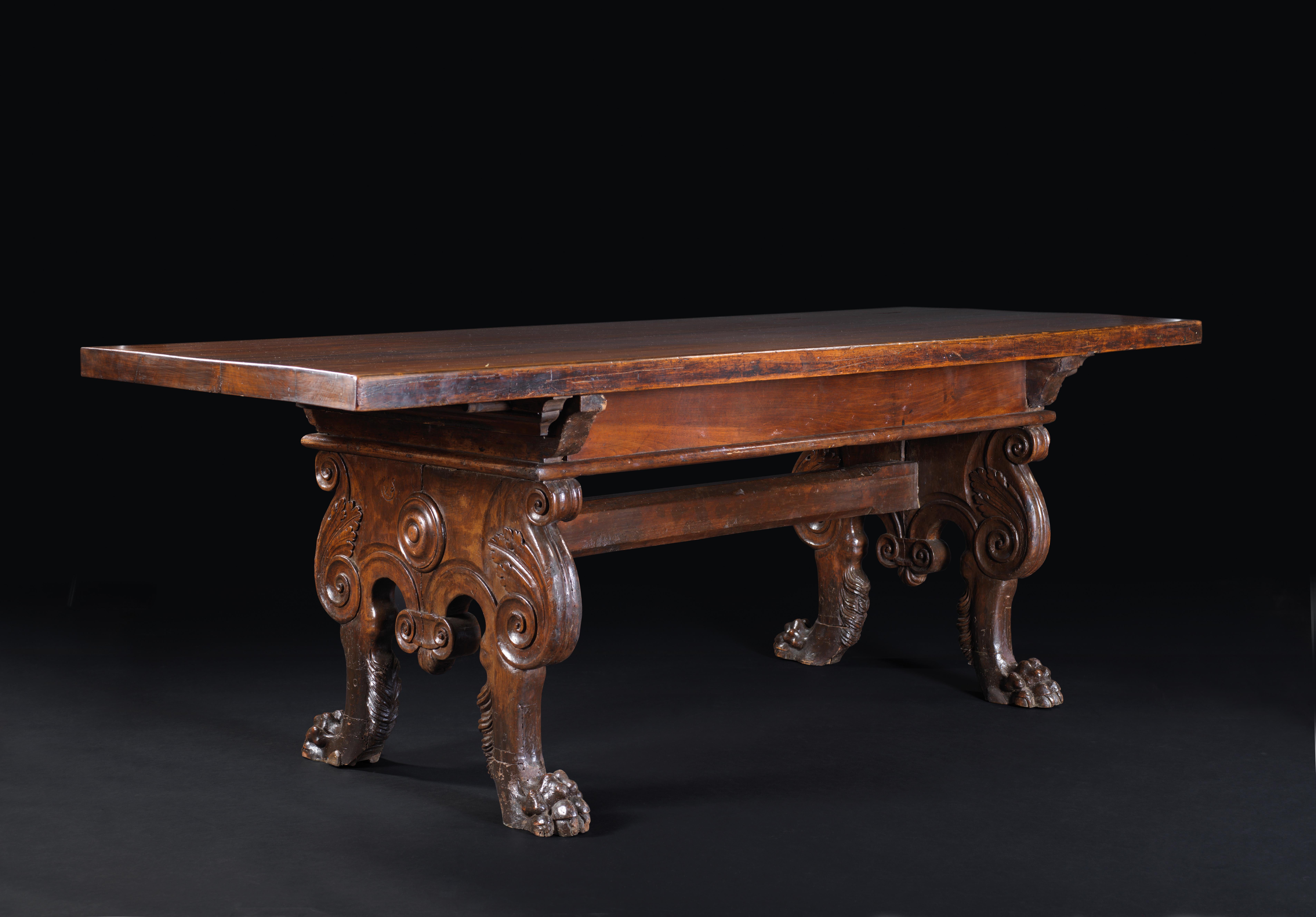 In the beginning the table was a movable furniture with removable feet, easy to build and disassemble. Most of the 15th and 16th century tables are built following the Roman cartibula principles that is a plate standing on two large stands secured