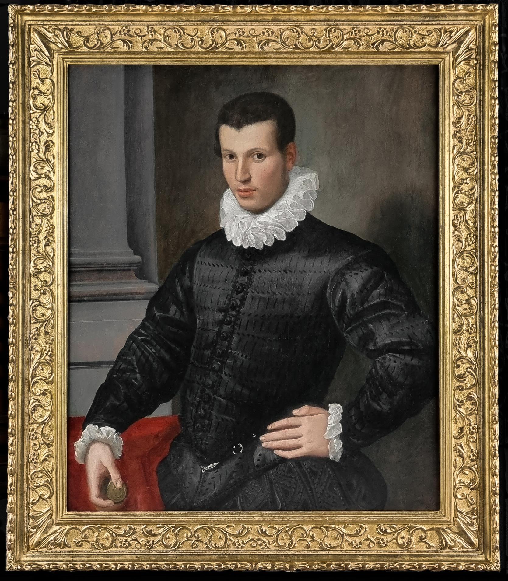 Portrait of a Gentleman in a Black Doublet Holding a Medallion c.1575/80 - Painting by 16th Century Florentine School