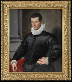Ritratto di un gentiluomo con una doppietta nera che tiene in mano un medaglione, 1575/80 ca.