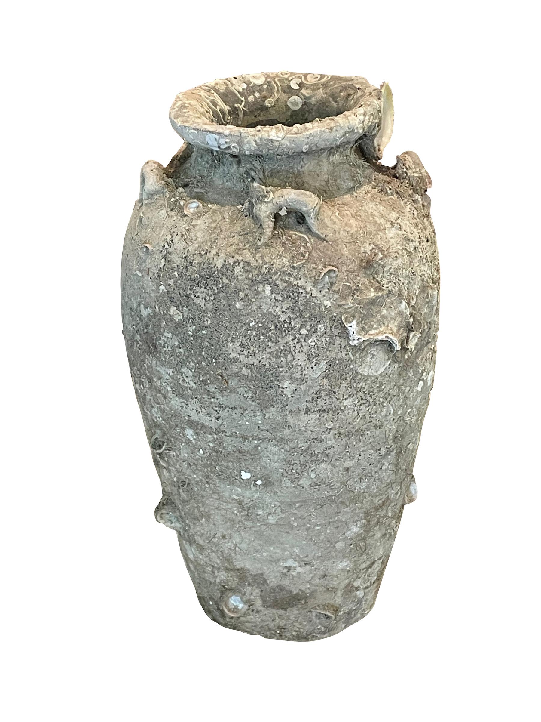 16th century Thailand Sawankhalok ceramic vase from the old city of Sawankhalok known for its pottery.
Beautiful and abundant fossil growth from being submerged under water.
Natural original patina.
Six Available
Part of a very large collection of