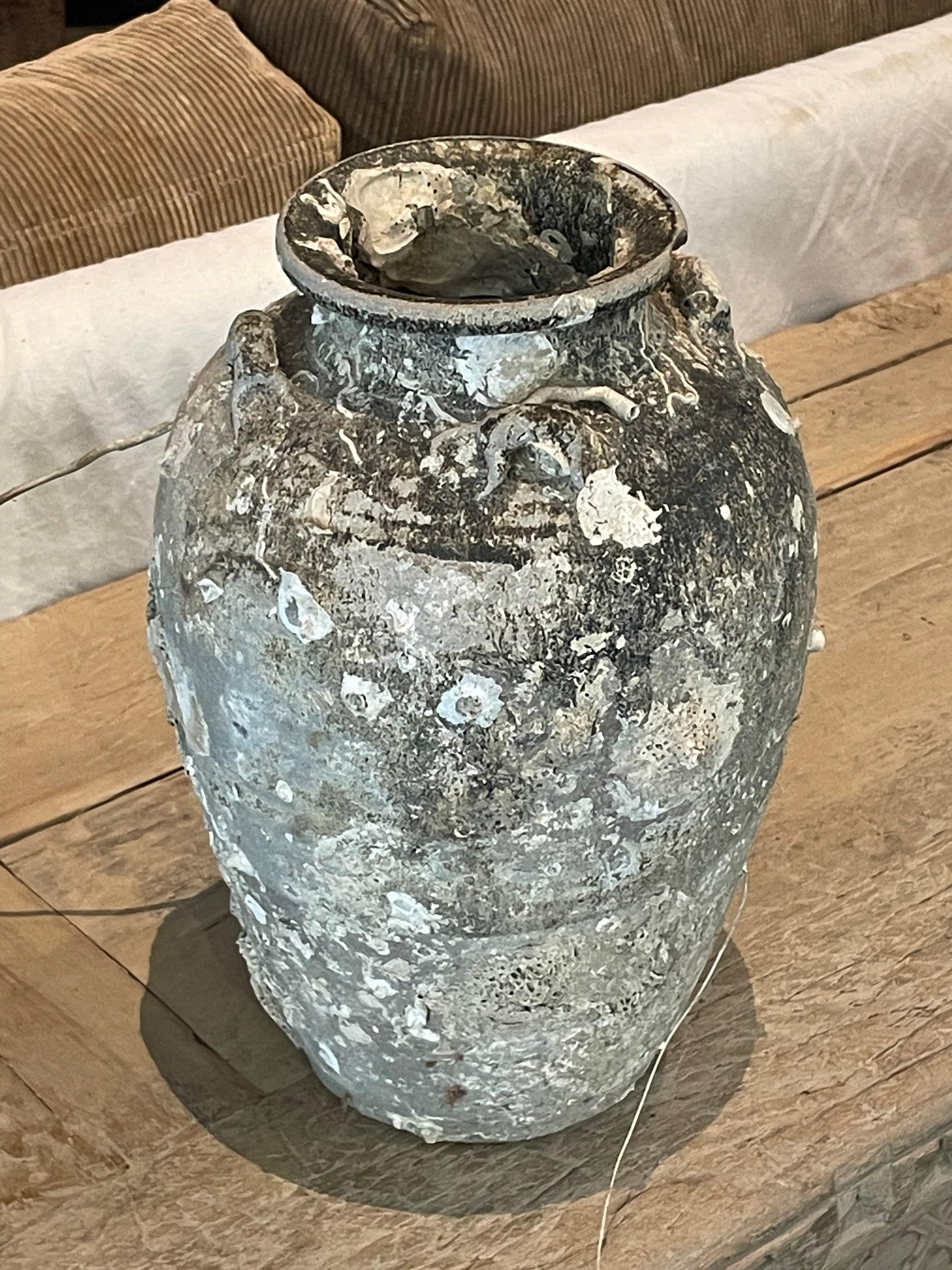 16th century Thailand Sawankhalok ceramic vase from the old city of Sawankhalok known for its pottery.
Beautiful and abundant fossil growth from being submerged under water.
Natural original patina.
Six Available
Part of a very large collection of