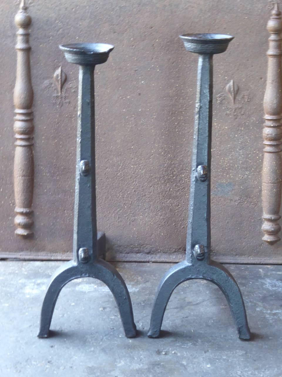 16th century French Gothic andirons made of cast iron. With faces on the spit hooks to discourage evil powers.

This product has to be shipped as freight due to its size and/or (volumetric) weight. You can contact us to find out the daily rate for a