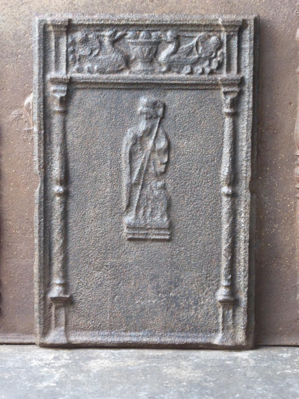 16th century German Gothic fireback with Apostle James, pillars and other decorations. This very old fireback is made in the early days of casting iron. Apostle James is the protector of the pilgrims. This fireback is described in 'Ofen- &