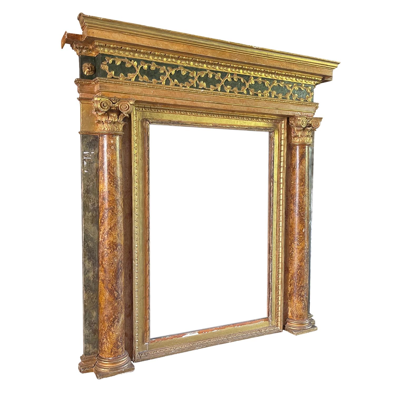 An Italian surround or formal fireplace mantel from an antique villa near Verona. The flanking superbly carved wooden Ionic columns have been finished with a Venetian marble paint. The entire interior gilded dentil frame is set onto a double frame.