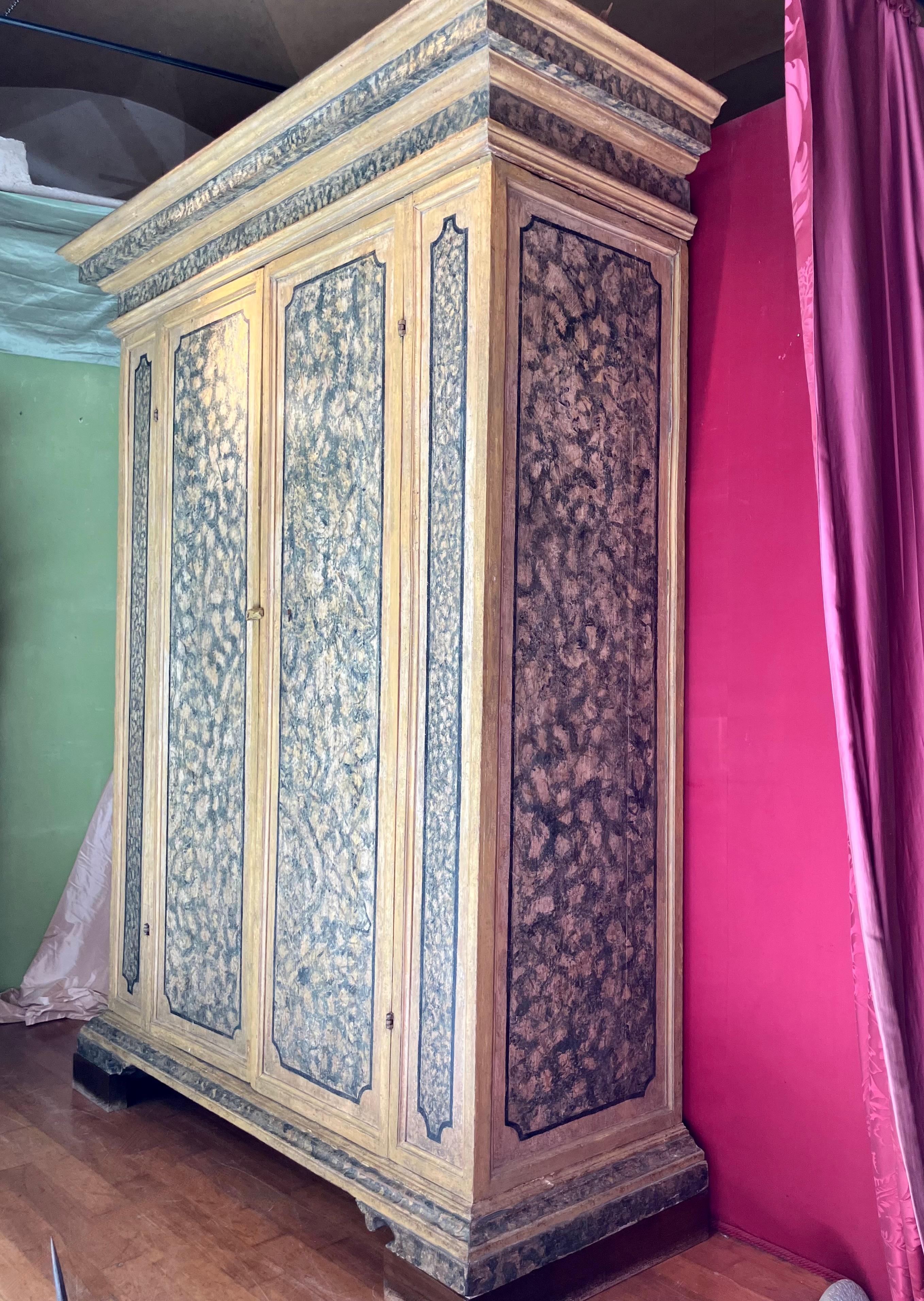 An extraordinary Italian Renaissance wooden cabinet from the 1500s awaits the discerning collector. This antique lacquered furniture piece, dating back to the 16th century, showcases a sophisticated design and a breathtaking lacquer finish painted