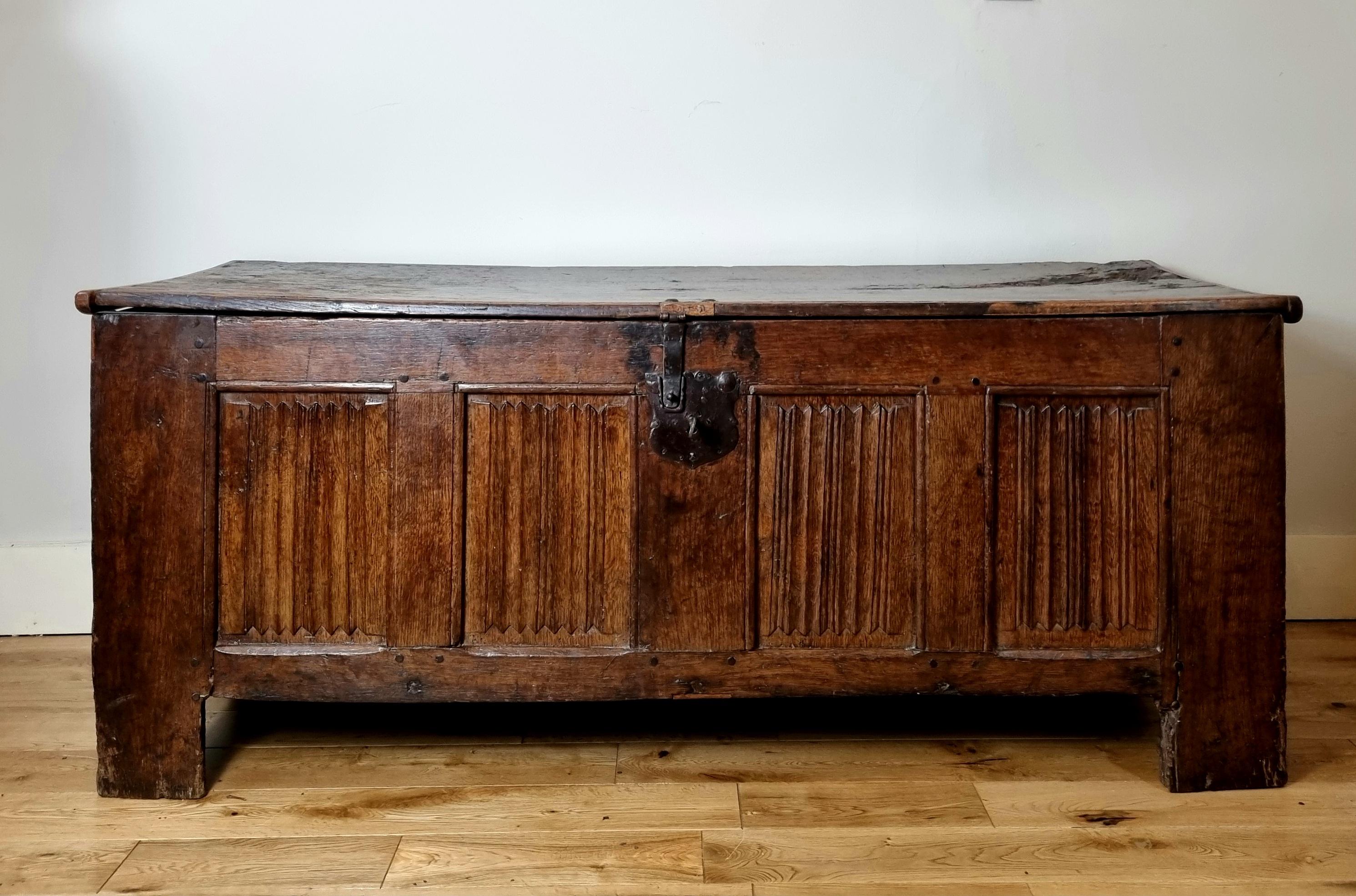 A late medieval oak coffer , circa 1500 

original planked lid , four panel early linen fold carved front , a nicely patinated honest coffer that hasn’t been restored , retaining all its original panels including lid , Desirable and unmistakable
