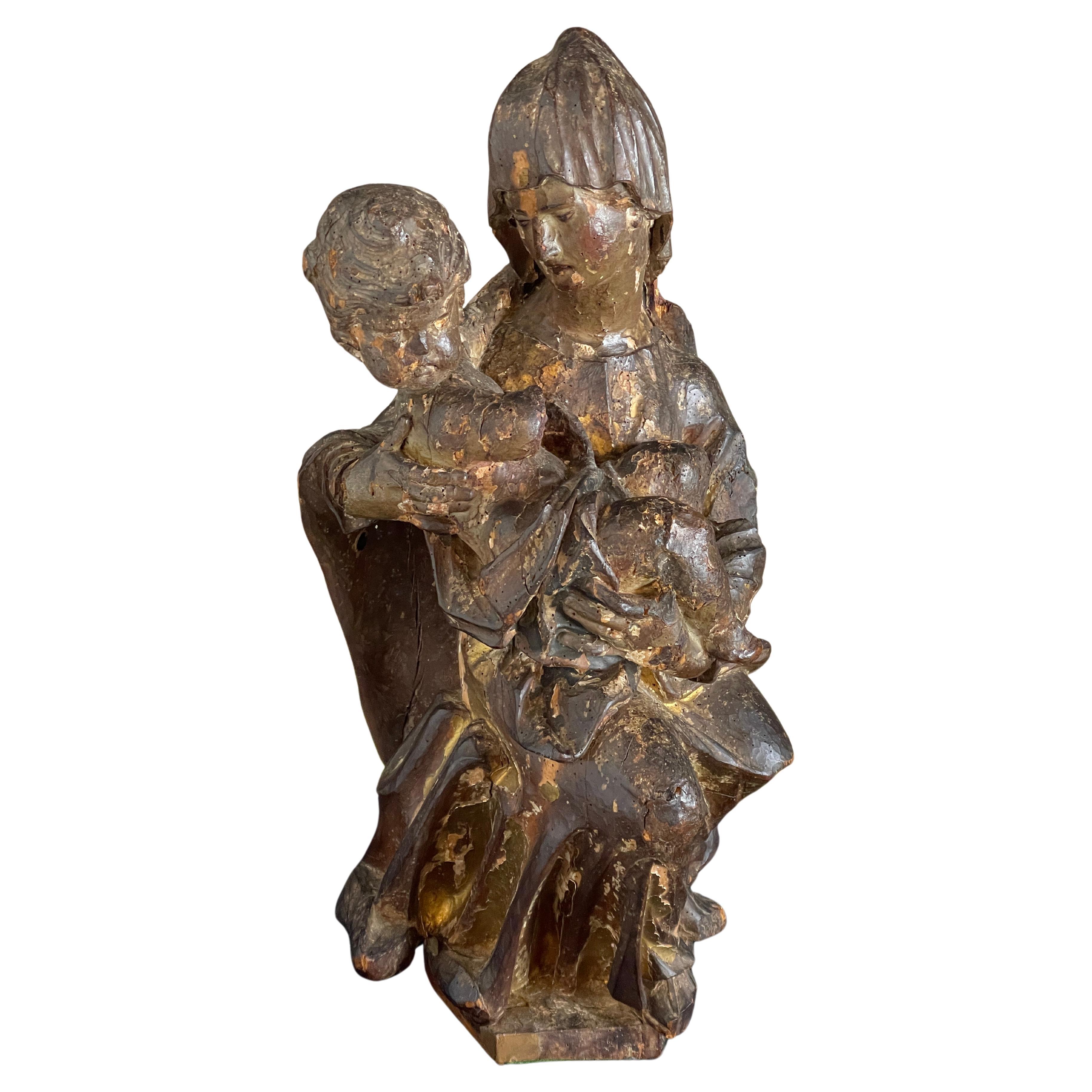 Sculpture en bois de la Madonna et de l'enfant du XVIe siècle en vente