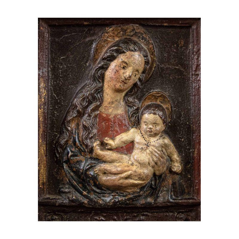 Tuscany, 16th century 

Madonna with Child

Polychrome stucco, 31 x 34 cm


The relief depicts the traditional couple of the Madonna and Child. He is depicted in the arms of his mother, posed realistically while extending his small right hand
