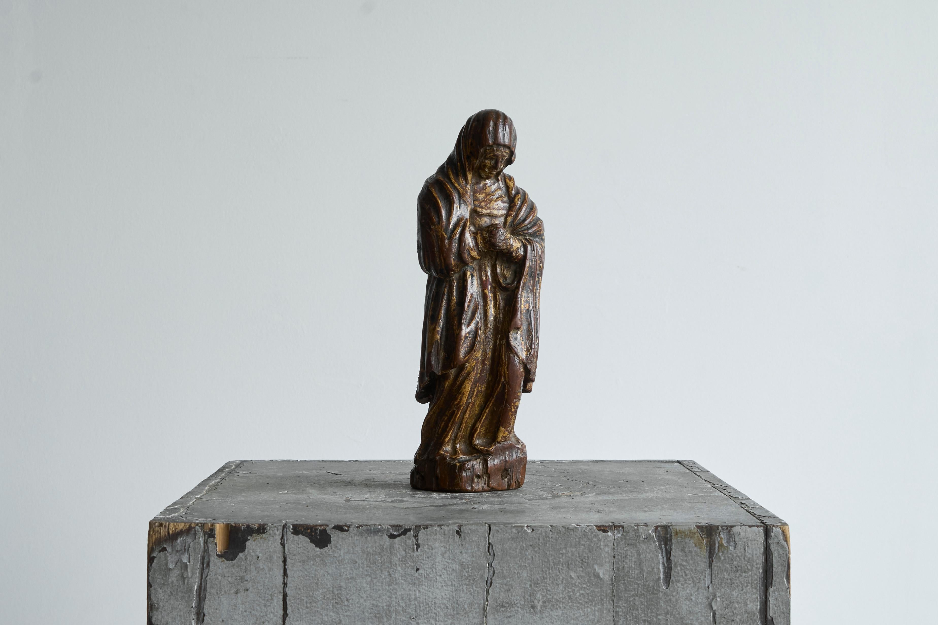 Mary Magdalene in Polychromed Carved Walnut 16th Century

Devotional figure in carved wood, depicting Mary Magdalene. Walnut, most probably Flemish and from the 16th century. 

It depicts a cloaked female figure - the Virgin Mary - shown in a