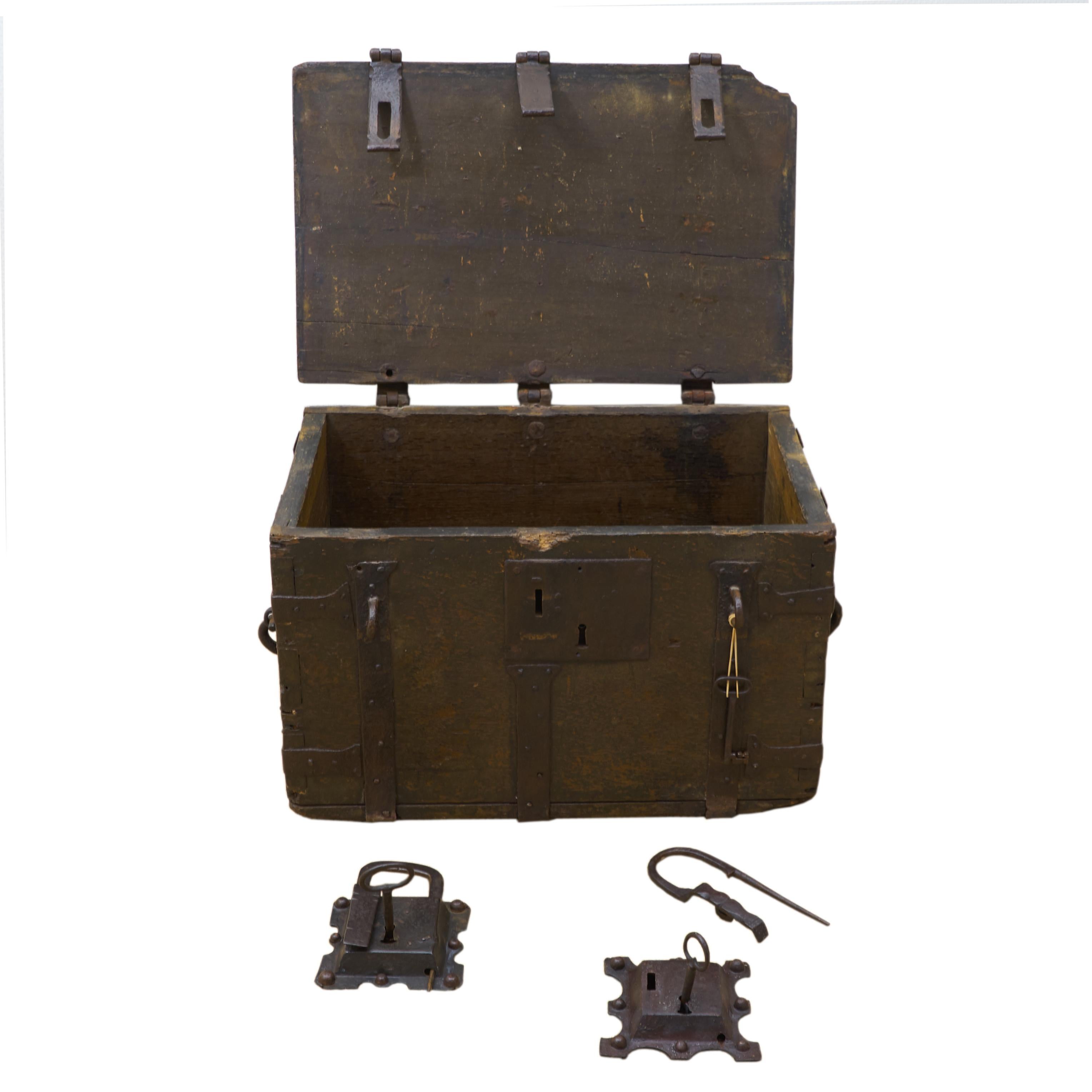 A Dutch mid-16th century oak chest with iron straps, small rests of polychrome painting.
The chest has three locks. One in the front and two original 16th century Dutch iron padlocks. The chest is very attractive because of its simplicity and