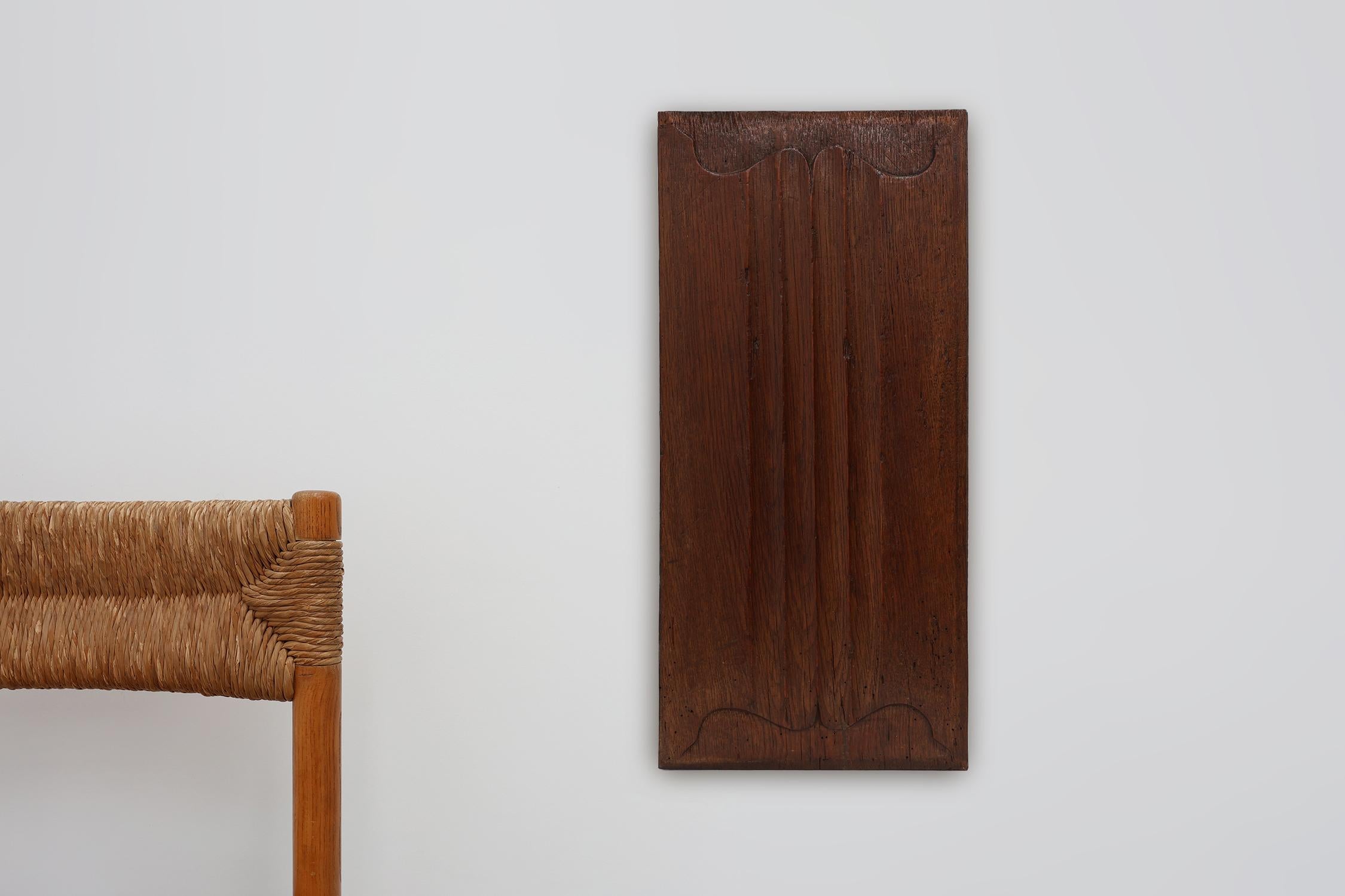 16th century / Belgium / Letter Panel / Oak / Gothic

A finely carved Gothic oak panel from 16th-century France. This architectural fragment features graceful vertical fluting framed by elegant, flowing arches at both the top and bottom—an