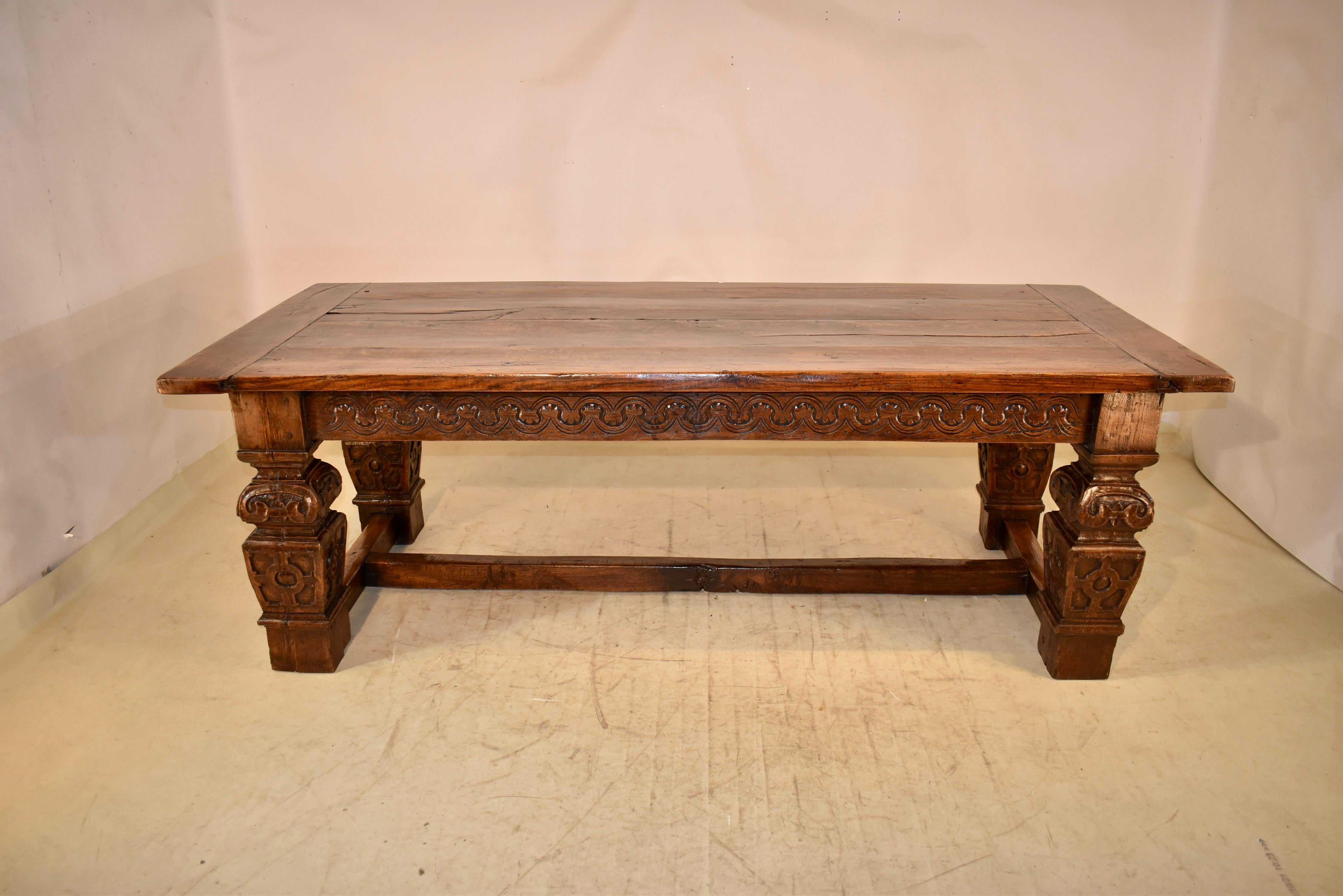 Rare and impressive PERIOD Elizabethan dining table of substantial size.  The top is made from four planks, and is banded at the ends to prevent shrinkage.  The apron is hand carved decorated.  The legs are massive, and are hand carved and turned. 