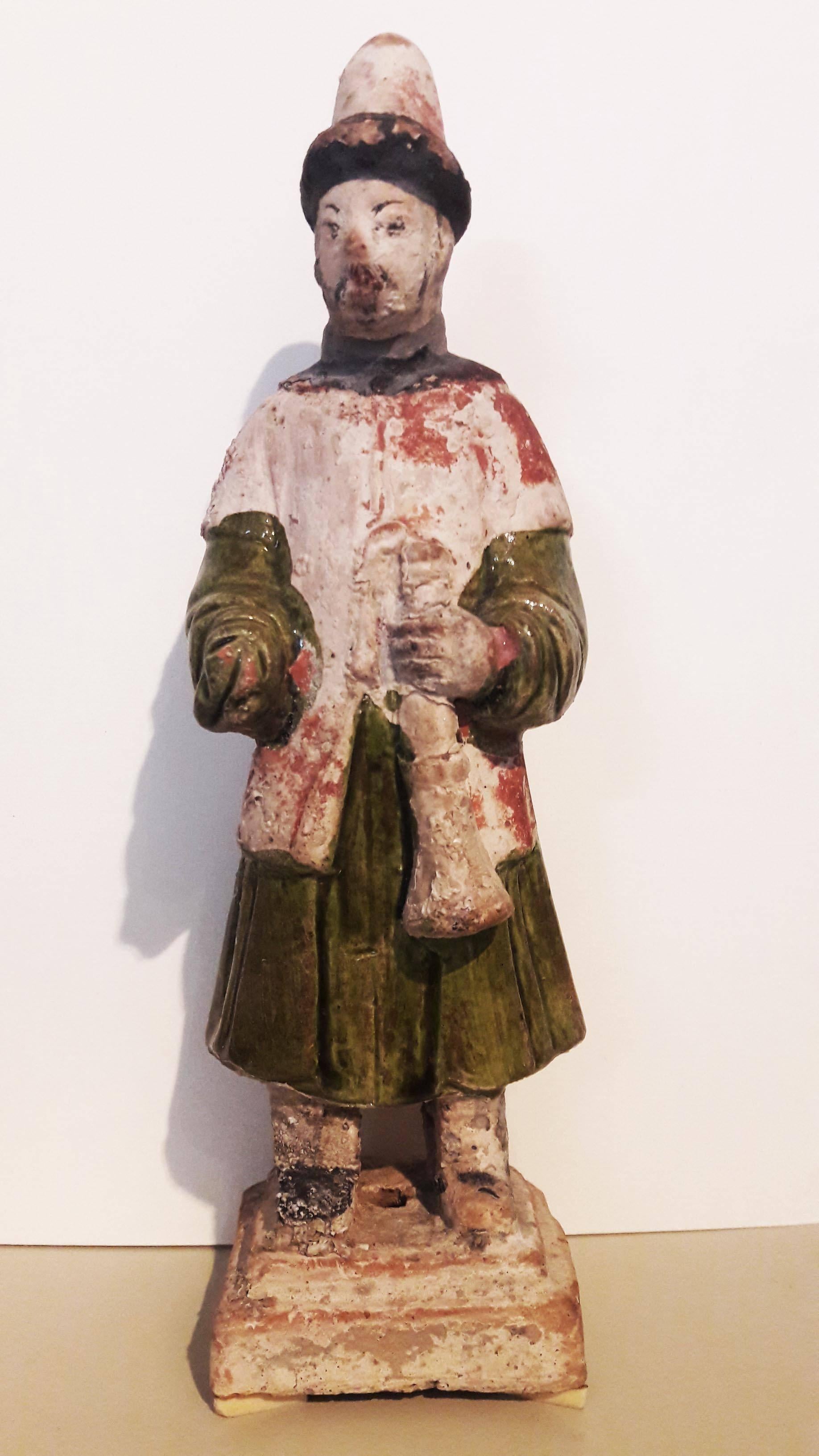 A ritual attendant figure, used in funerary ceremonies during the Ming dynasty period (1368-1644). Glazed terracotta.