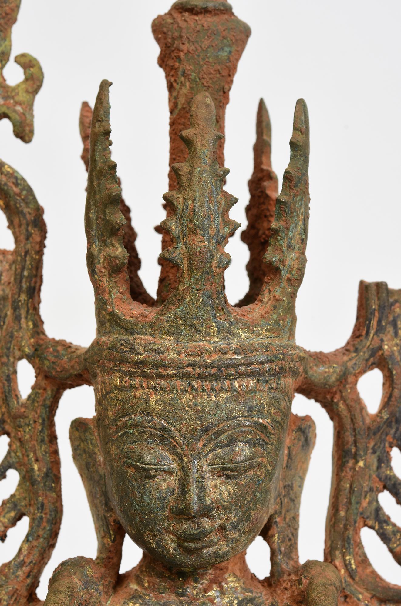 Antique Burmese bronze seated crowned Buddha, or sometimes known as 'King Buddha', wearing diadem-crowns and ornaments of kings instead of ordinary monk's robes.

Crowned Buddha represents the Buddha's role as a universal sovereign. 

Age: Burma,