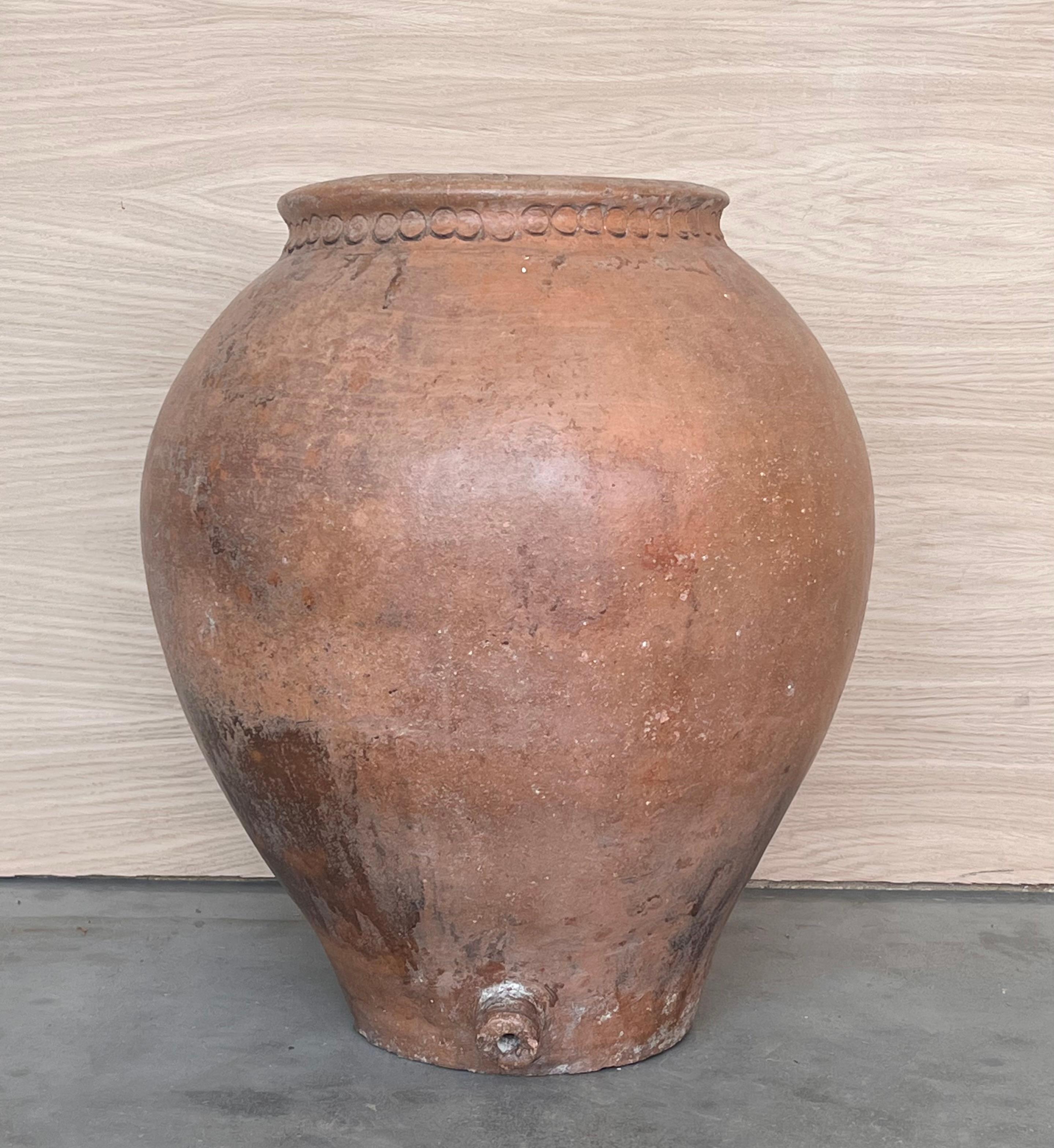 16th Century Spanish Terracotta Vase

Hand made marks around the vase. 