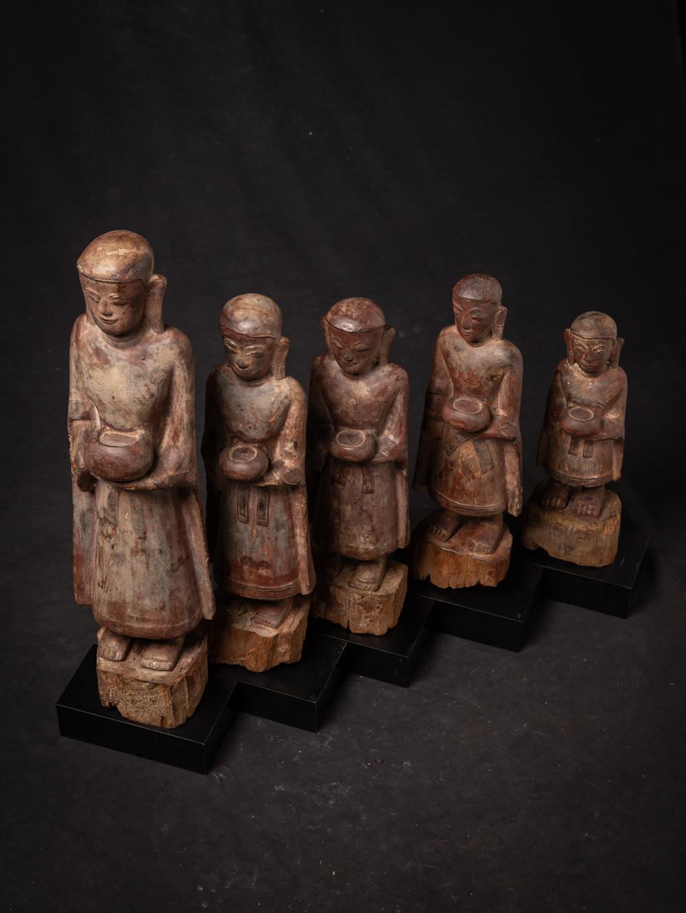 The Special set of 5 antique wooden Monk statues is a captivating ensemble that encapsulates the spiritual and artistic essence of Burma. Crafted from wood and adorned With traces of 24 krt. gilding. Originally the statues were once fully gilded,