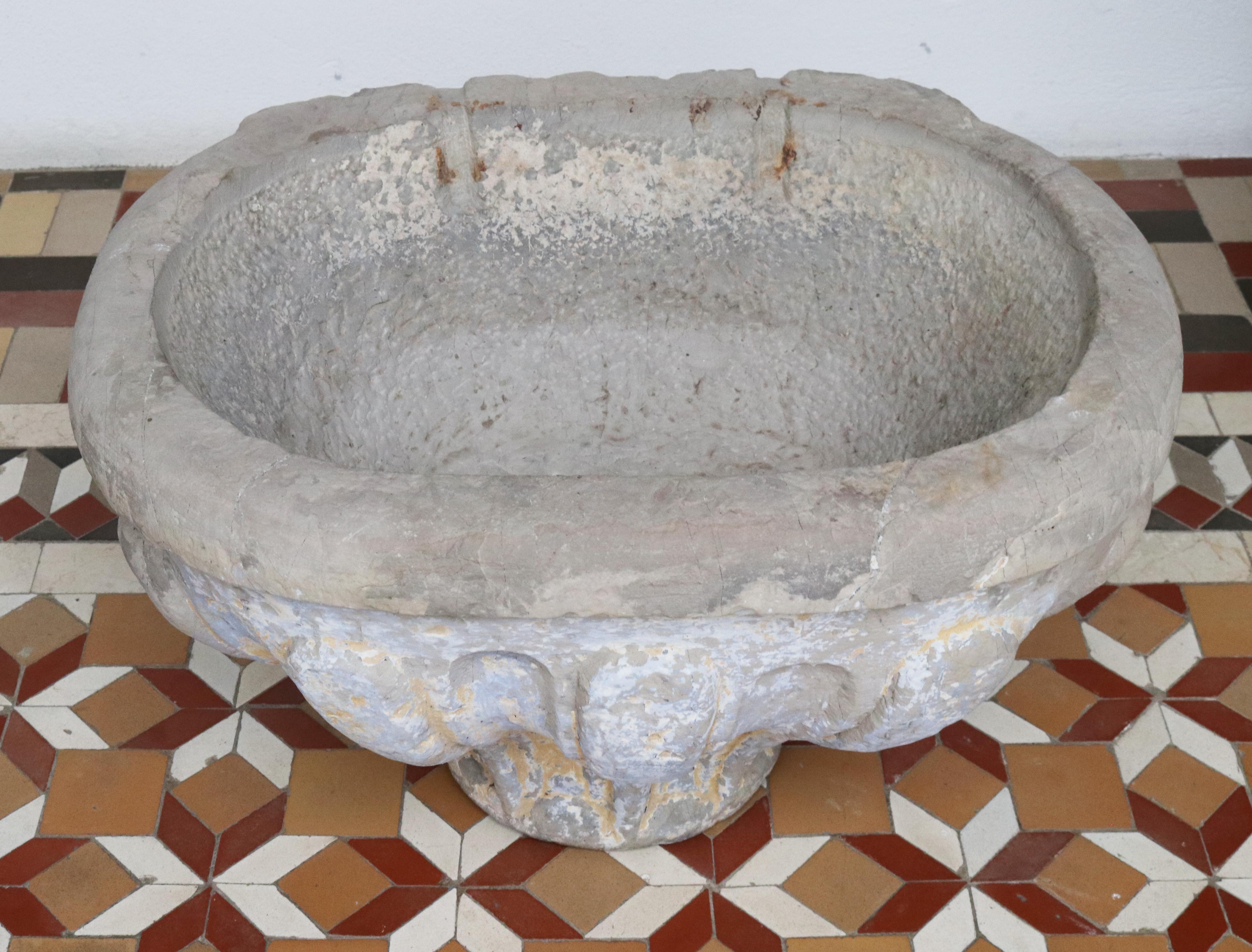 16th century stone conch shaped holy water stoup.