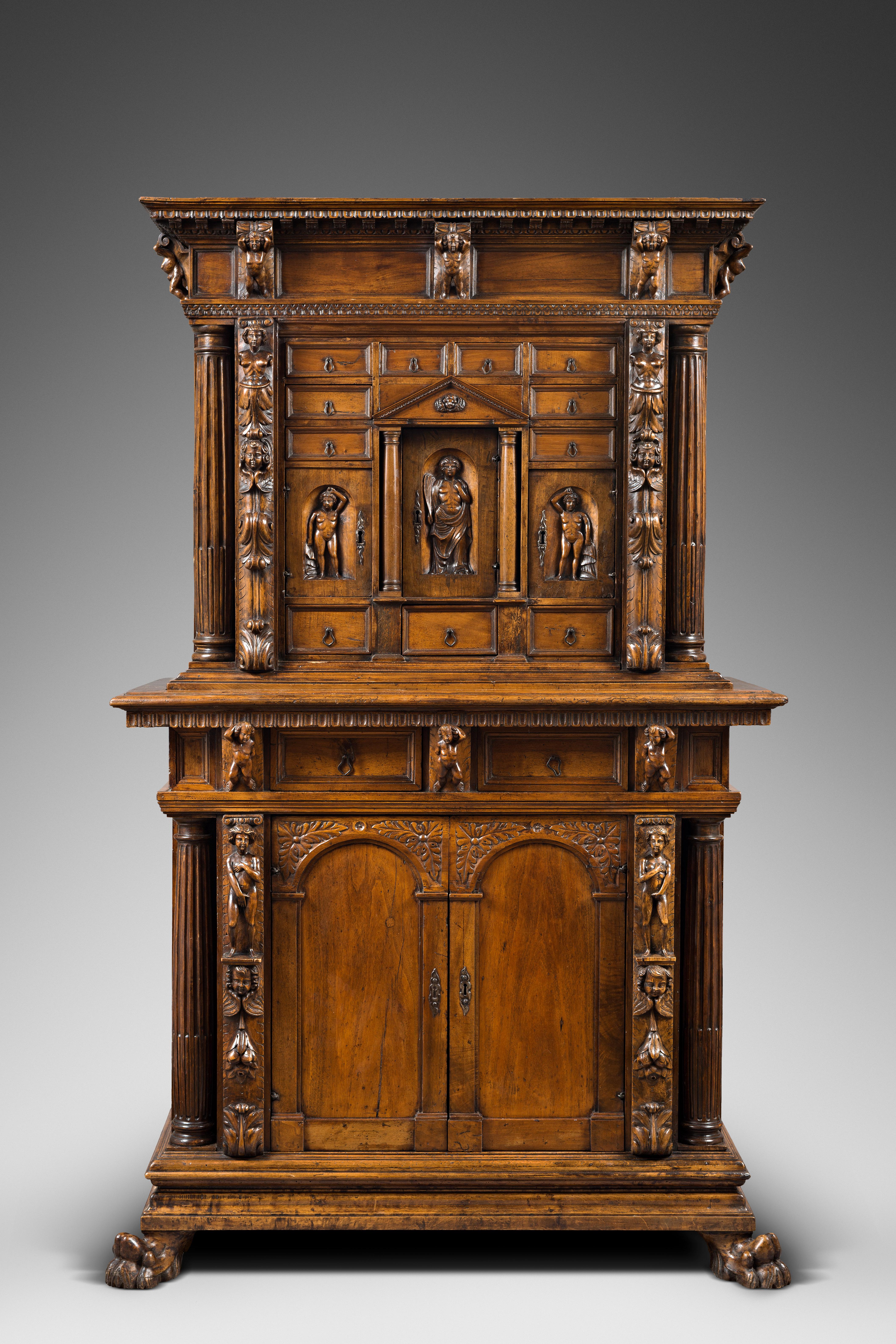 This stipo, little Italian cabinet made of walnut and walnut burl, is a remarkable example of Mannerism applied to decorative arts during the late 16th century.

While the Mannerist movement was born and developed in Florence before becoming