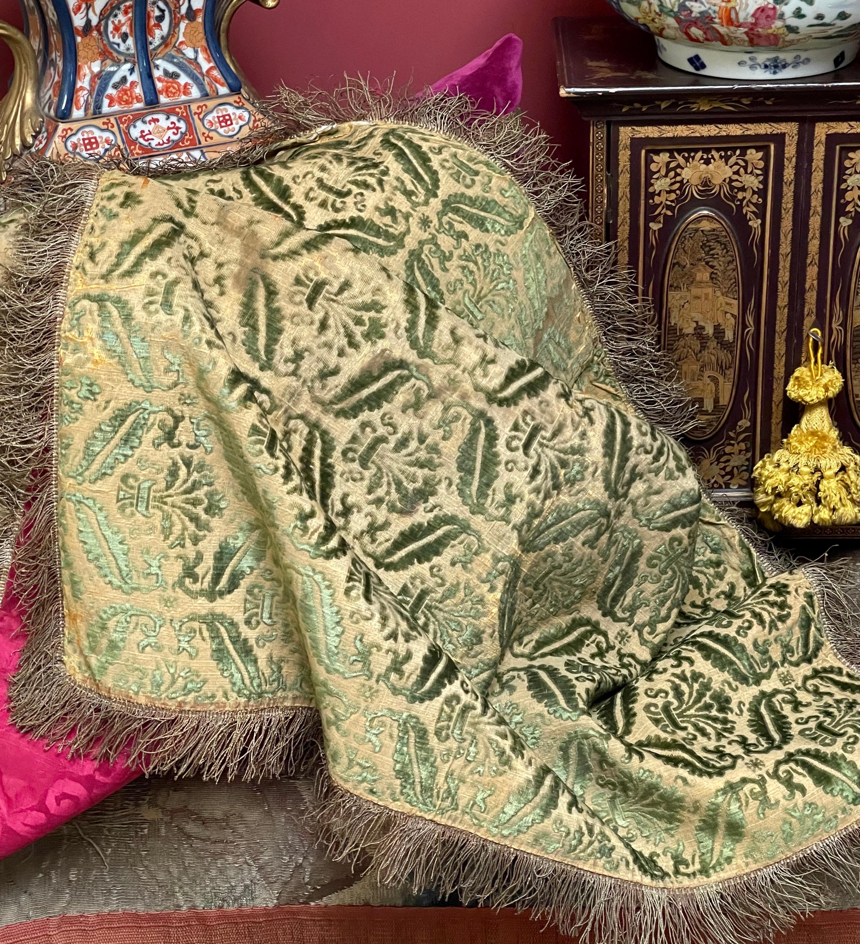 A Very Rare Venetian Velvet Cover

Cut and uncut voided silk velvet in green on a light gold ground

The pattern is a lattice of Leaf motifs, with the diamond shaped openings containing stylized flowers

Comprising two 20 inch loom widths panels