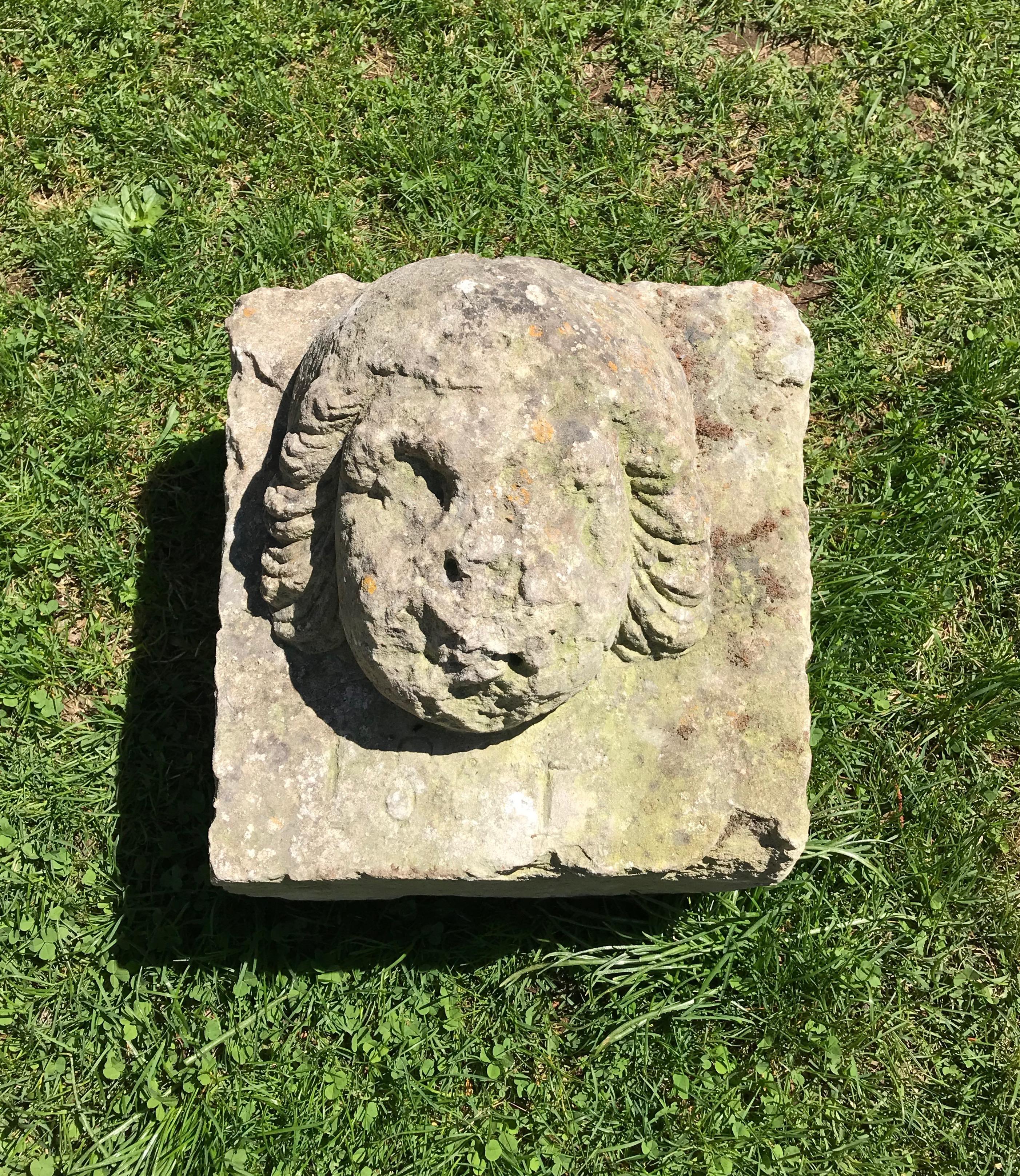 Although there is a date of 1861 incised below the face, we know this piece is much earlier from its form and carving detail. We believe she originally was embedded in a wall over a doorway and could be so again. However, she would also make a