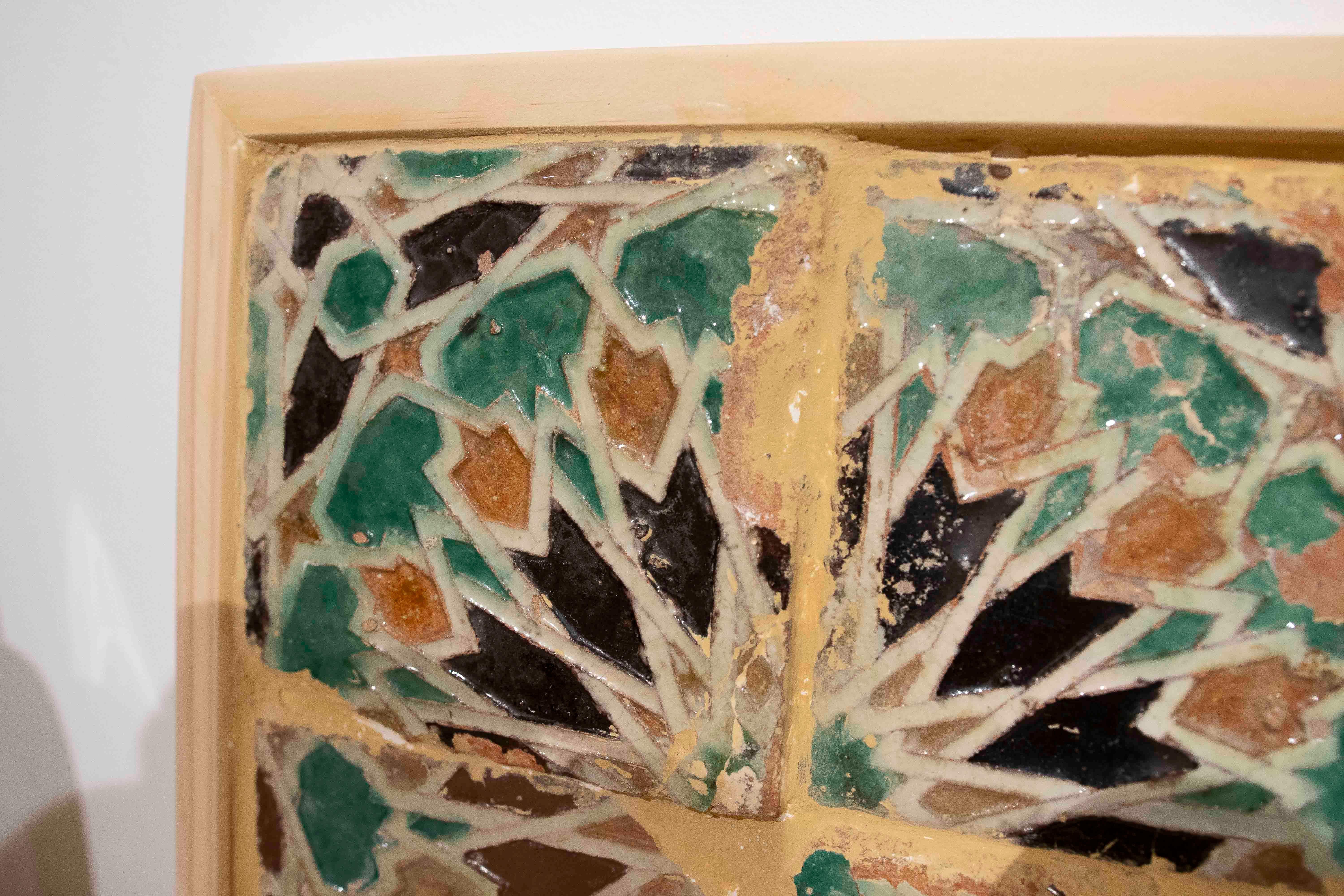 Smaltato 16th Panel of Four Antique Geometric Glazed Tiles in a Wooden Frame in vendita