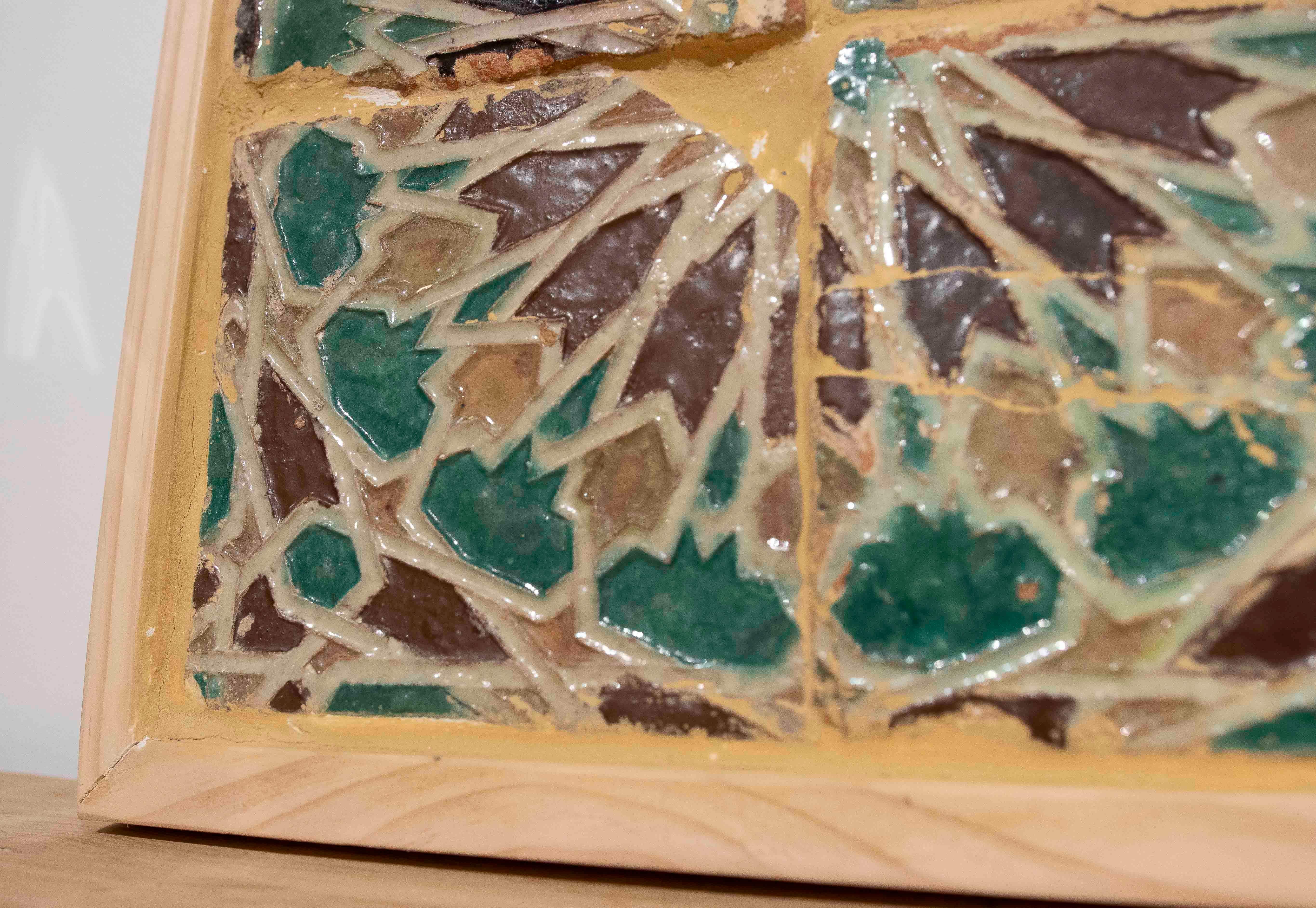 Fino al XVIII secolo 16th Panel of Four Antique Geometric Glazed Tiles in a Wooden Frame in vendita