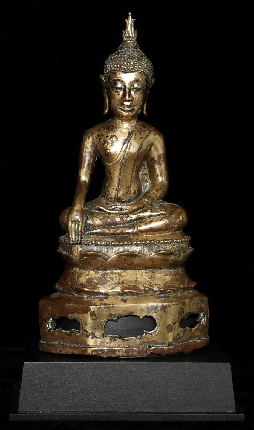 With the very best sculpting and casting of its kind- I present this 16thC Northern Thai Bronze Buddha. Deeply serene face. Nice size at 10 1/8 inches tall, 12 1/8 inches on a custom Stand. Complex patina, with some past cleaning that was likely