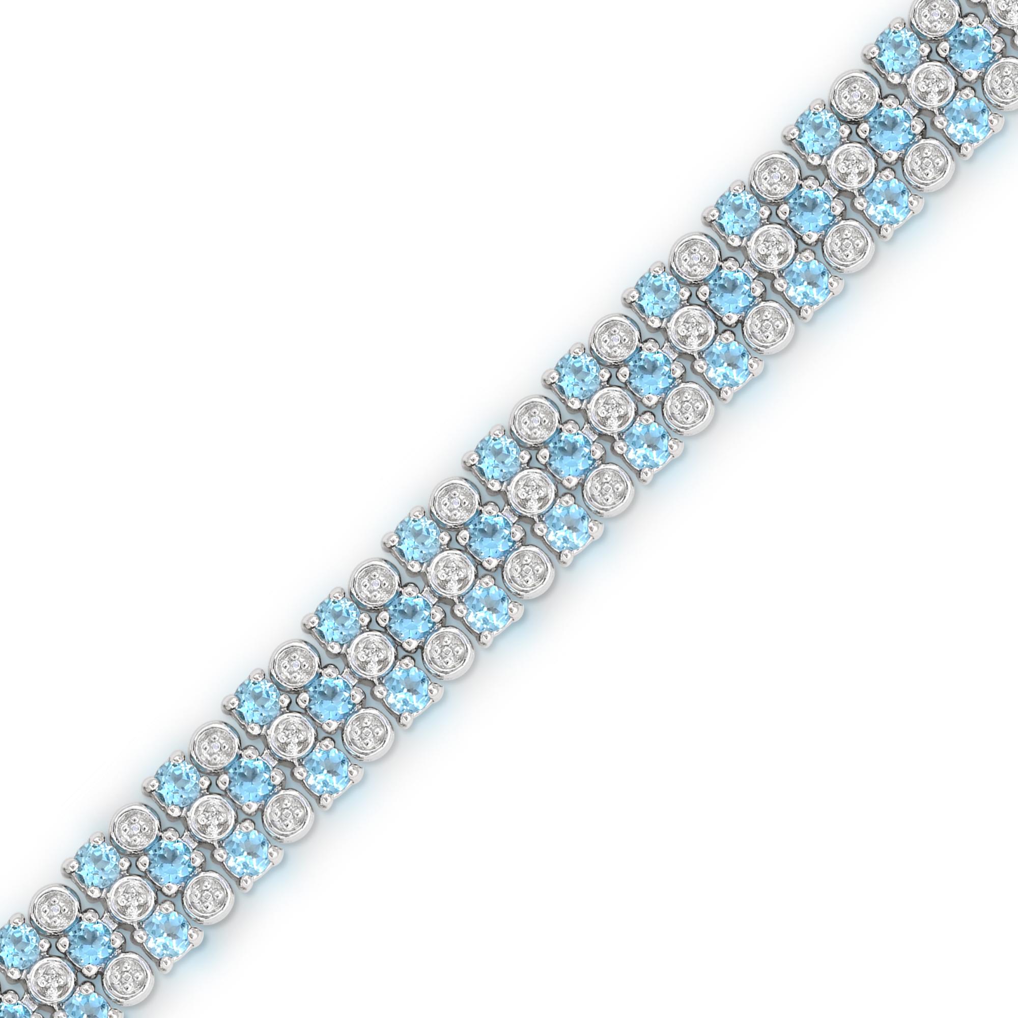 This elegant sterling silver bracelet features 72 Swiss blue topaz accented by 6 pieces of single-cut round white diamonds prong and bezel set in sterling silver spaced repeatedly. Designed for both comfort and style, this bracelet is secured with a