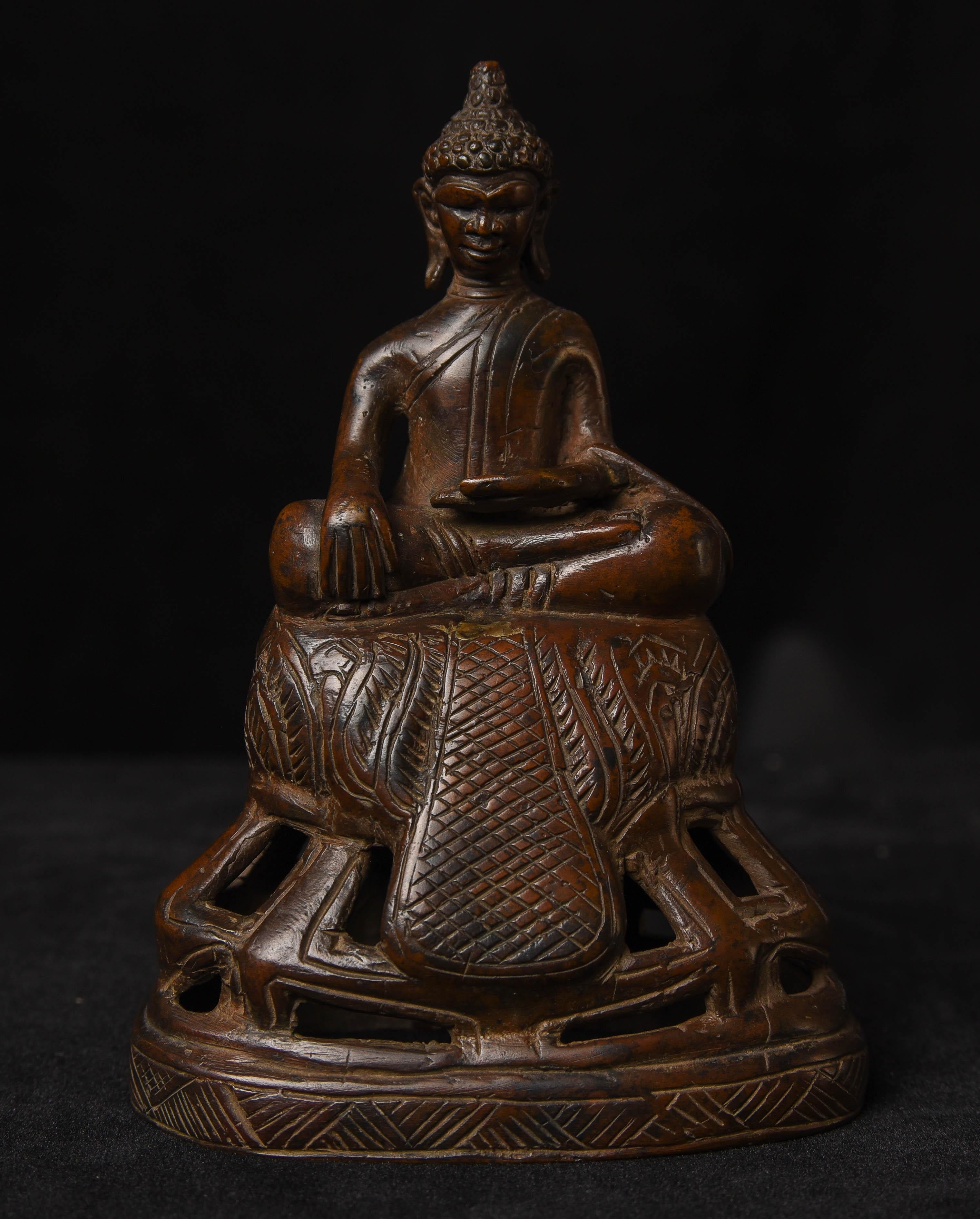 A very fine 17/18thC Cambodian Buddha with a wonderful face, base, and patina. This piece measures 5