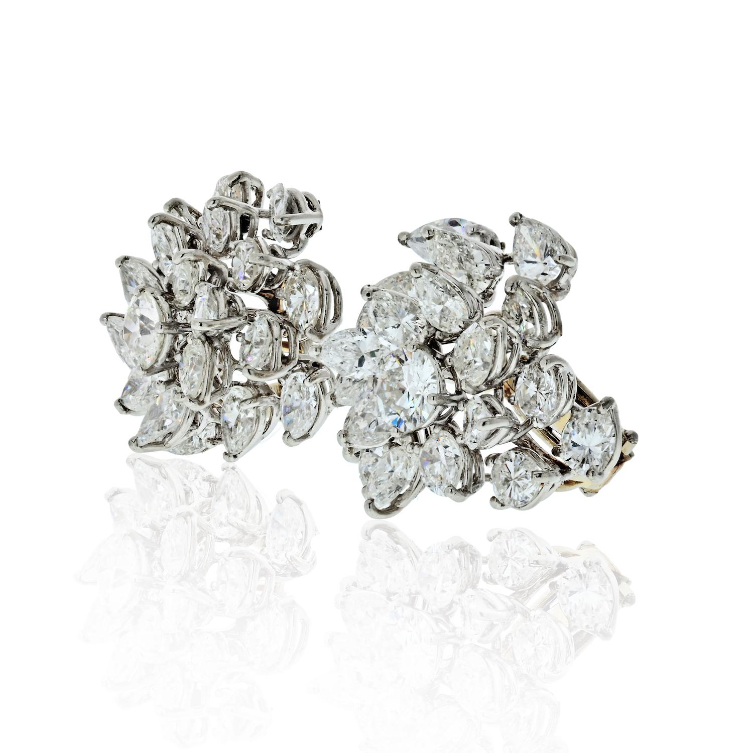 Beautiful cluster diamond earrings crafted in Platinum. Set with mixed-cut diamonds of 17.65cts.
Post back with an omega backing. 
Each earring showcases a round cut in the center and pear shapes overall.
Center round cut measures about 0.80ct.