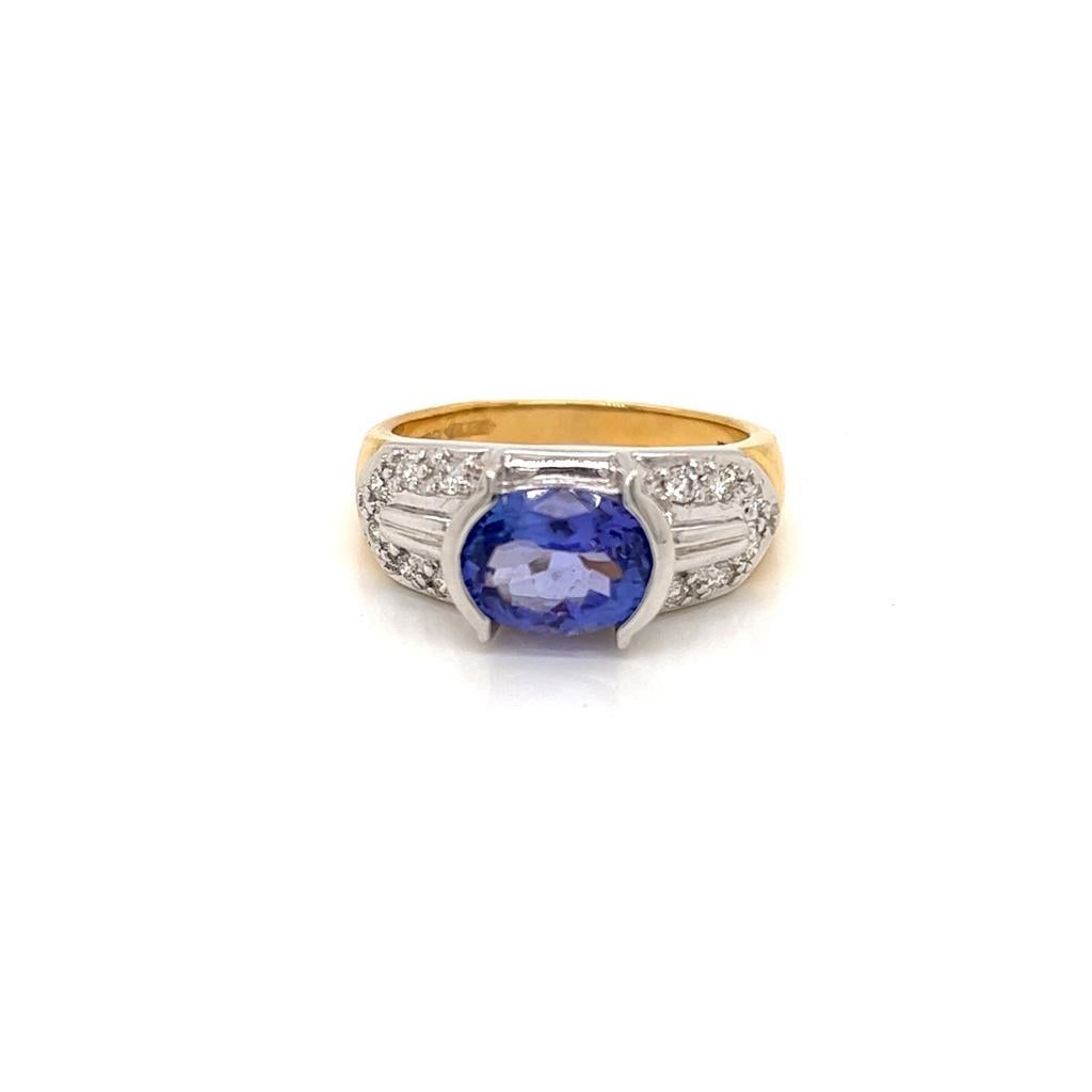 1.7 Carat Oval Tanzanite and Diamond Ring in 18 Karat Yellow and White Gold

This unique ring features a 1.7 Carat Oval Tanzanite on an intricately detailed diamond encrusted 18K Gold ring.

The Tanzanite is held in a tension setting in 18K White