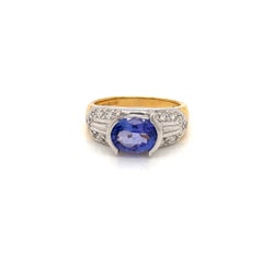 1.7 Carat Oval Tanzanite and Diamond Ring in 18 Karat Yellow and White Gold