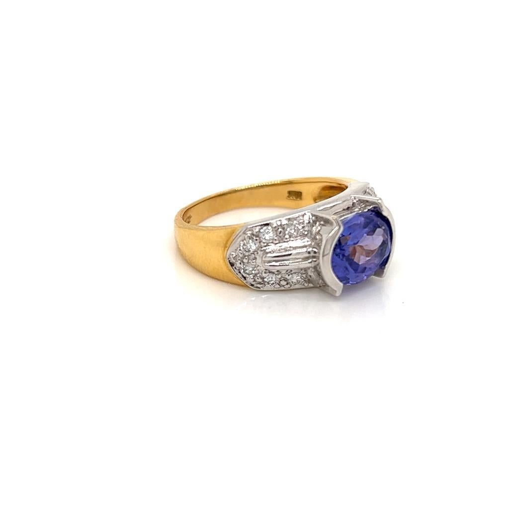 Art Deco 1.7 Carat Oval Tanzanite and Diamond Ring in 18 Karat Yellow and White Gold For Sale