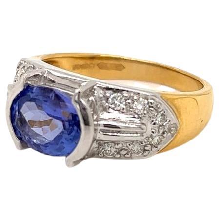 1.7 Carat Oval Tanzanite and Diamond Ring in 18 Karat Yellow and White Gold For Sale