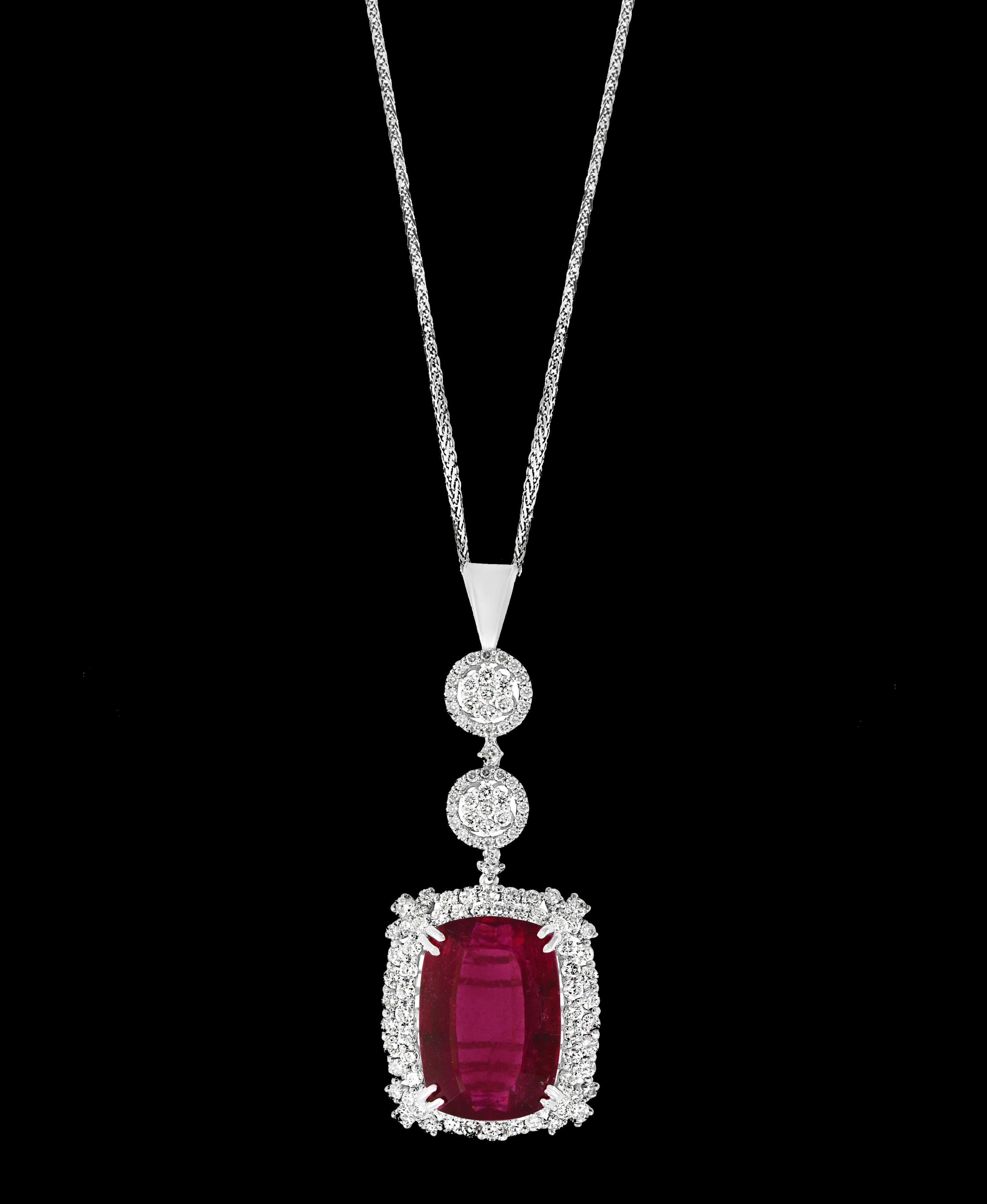  This spectacular Pendant Necklace is a true masterpiece, consisting of a single Cushion Shape Rubelite that weighs an impressive 16.97 Carat. The Rubelite is surrounded by approximately 4 Carats of brilliant cut diamonds, which add to the overall