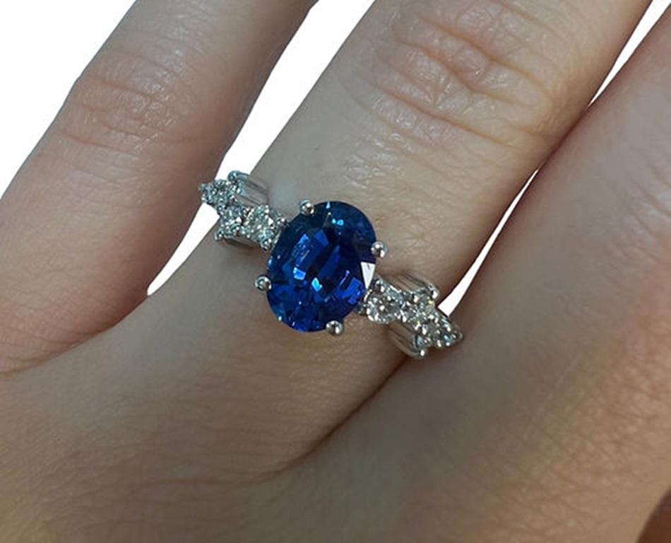 Sapphire Weight: 1.71 CTs, Measurements: 8x6 mm, Diamond Weight: 0.20 CTs, Metal: 18K White Gold, Gold Weight: 3.41 gm, Ring Size: 6.5, Shape: Oval, Color: Intense Blue, Hardness: 9, Birthstone: September