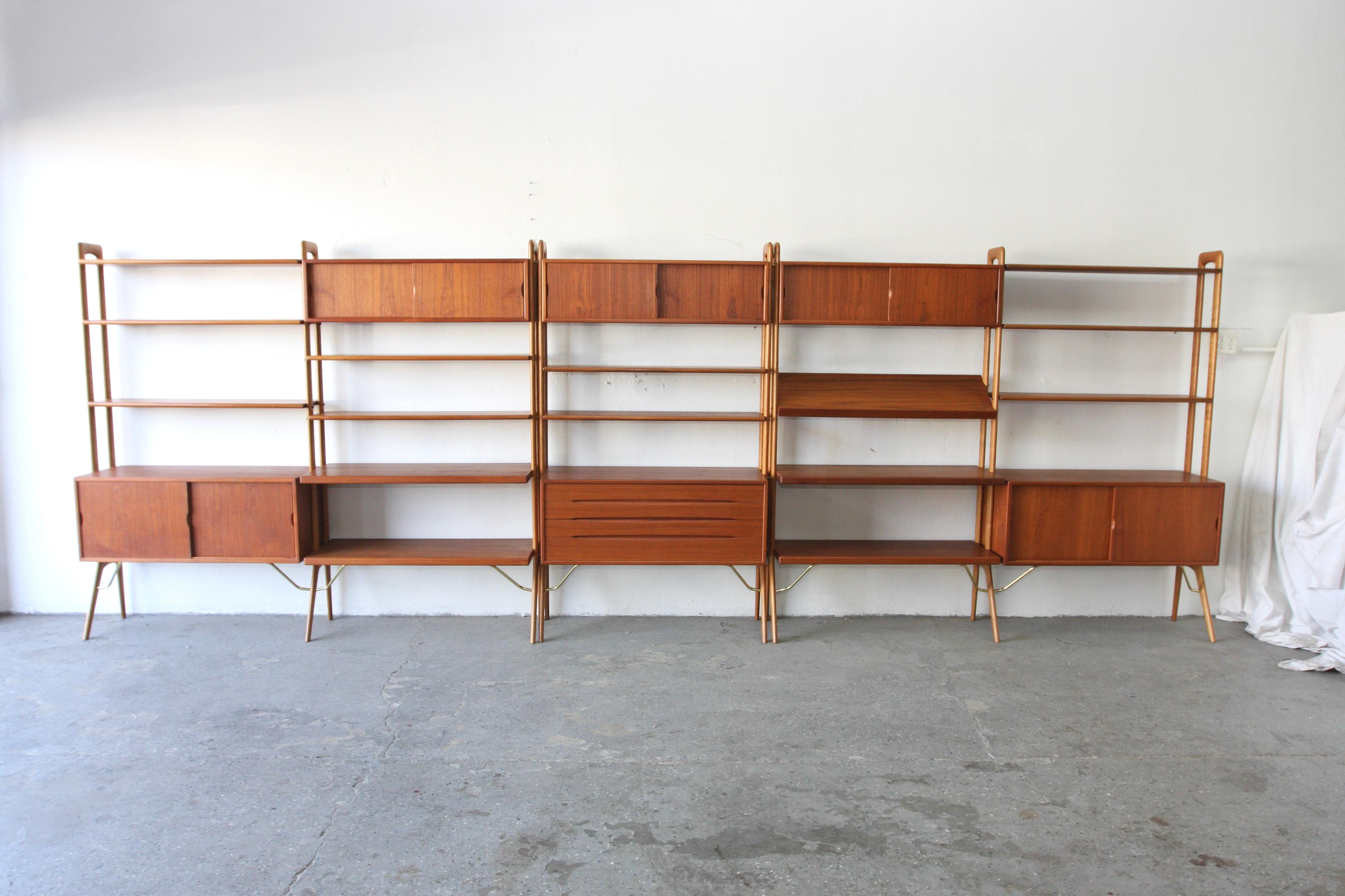 Extremely rare wall unit / room divider designed by Kurt Ostervig for KP Mobler. This gorgeous, teak system is fully finished on the back, allowing for use as a freestanding room divider. It also modular can add or rearrange shelves and cabinets ,