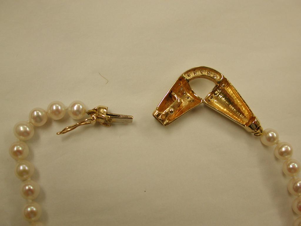 Bead Single Row of Cultered Pearls with 14 Carat and Diamond Snap, circa 1980 For Sale