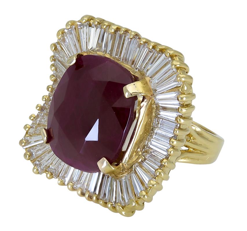 Showcasing a lustrous 17.0 carat cushion cut red ruby, set in a beautiful wavy design accented with tapered baguette diamonds. Made in 18k yellow gold.
Ruby weighs 17.0 carats total.
Baguette Diamonds weigh 0.90 carats total.
Size 7.5 US