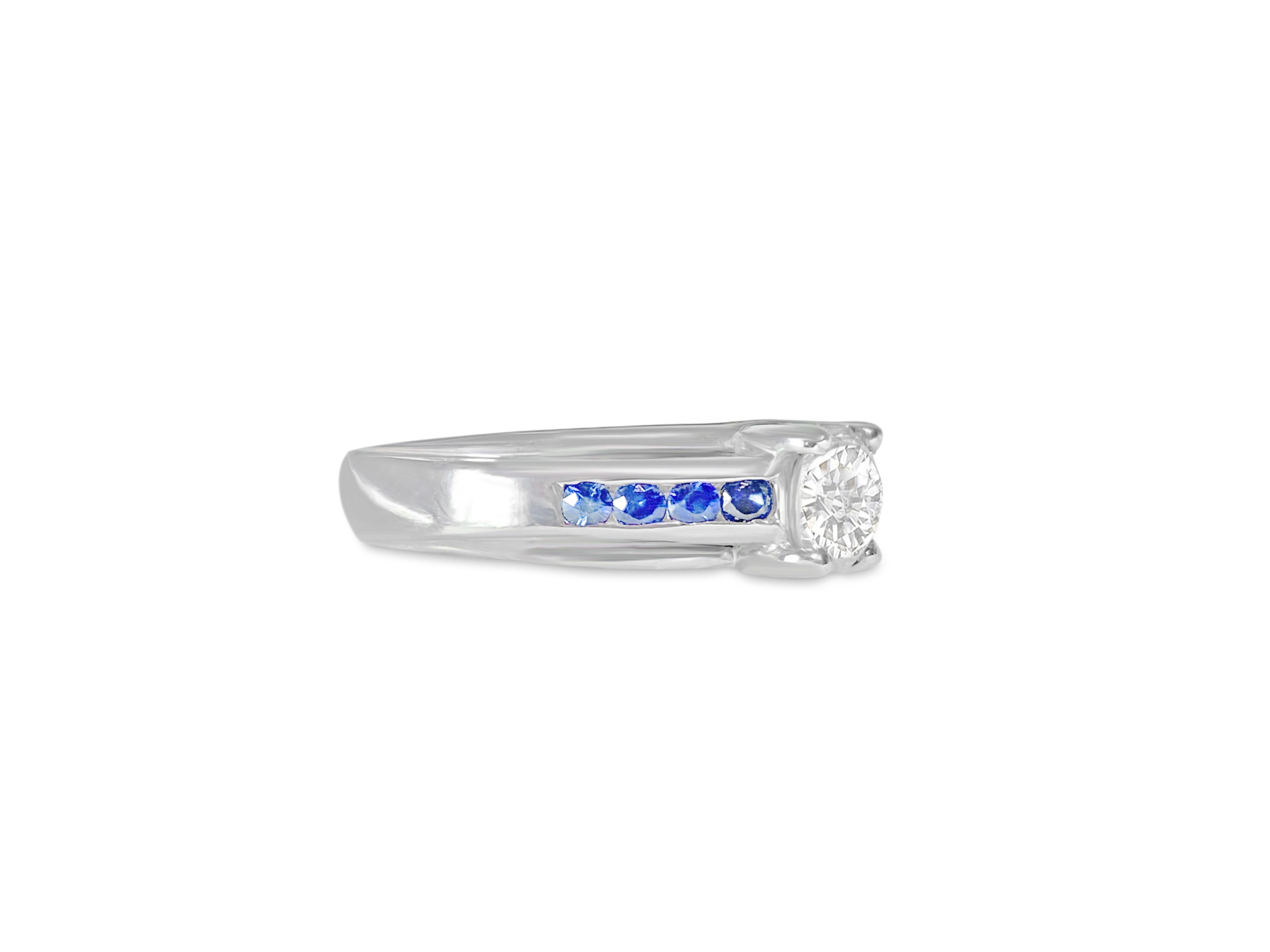 Metal: 18K white gold.

Diamond: 1.10 carat. Round brilliant cut set in prong setting. SI3 Clarity and G color.

Blue sapphire: 0.60 cwt. Cornflower blue sapphires set in channel setting. Round cut sapphires.

All stones are 100% natural earth